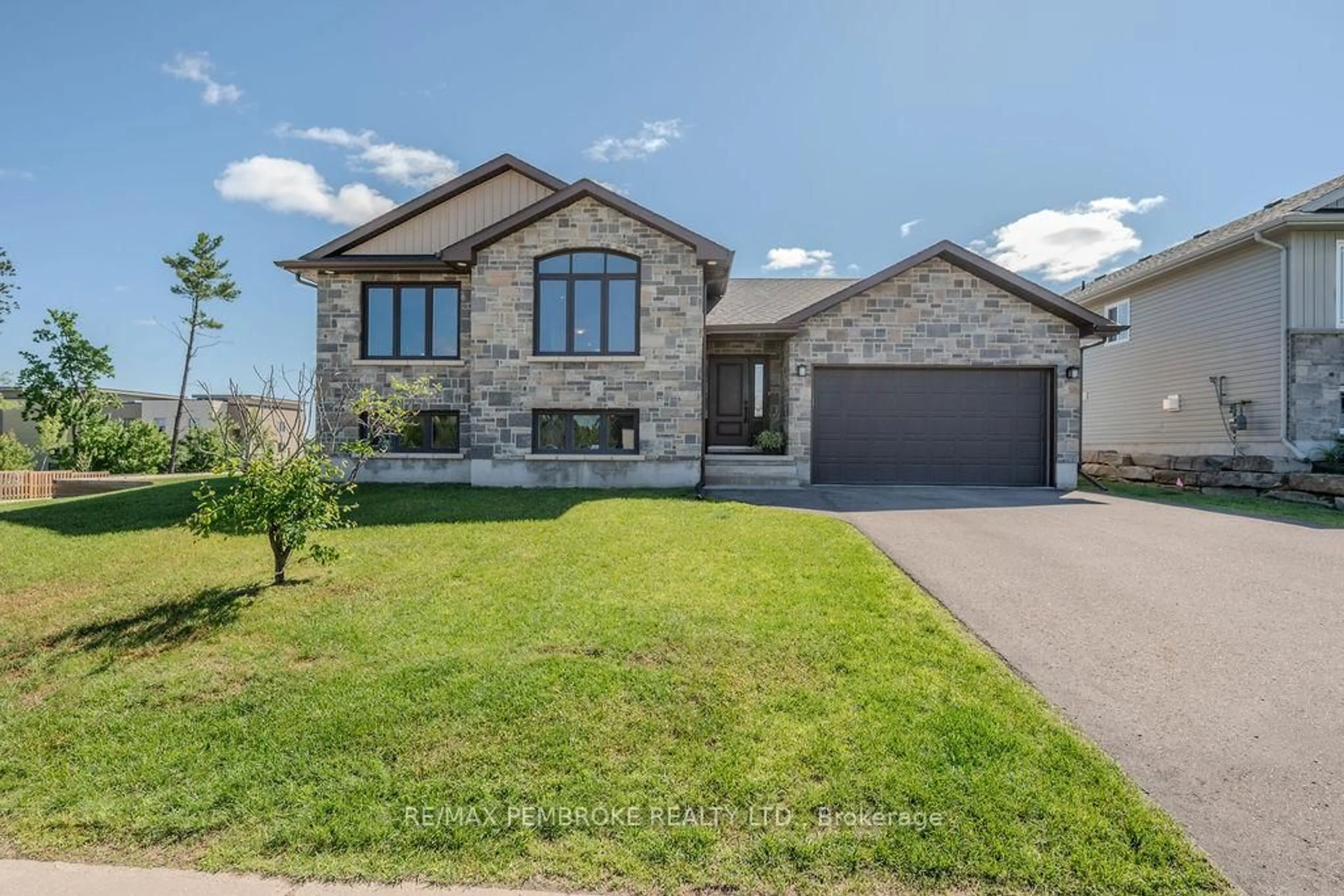 Home with brick exterior material, street for 1011 Butler Blvd, Petawawa Ontario K8H 0C2