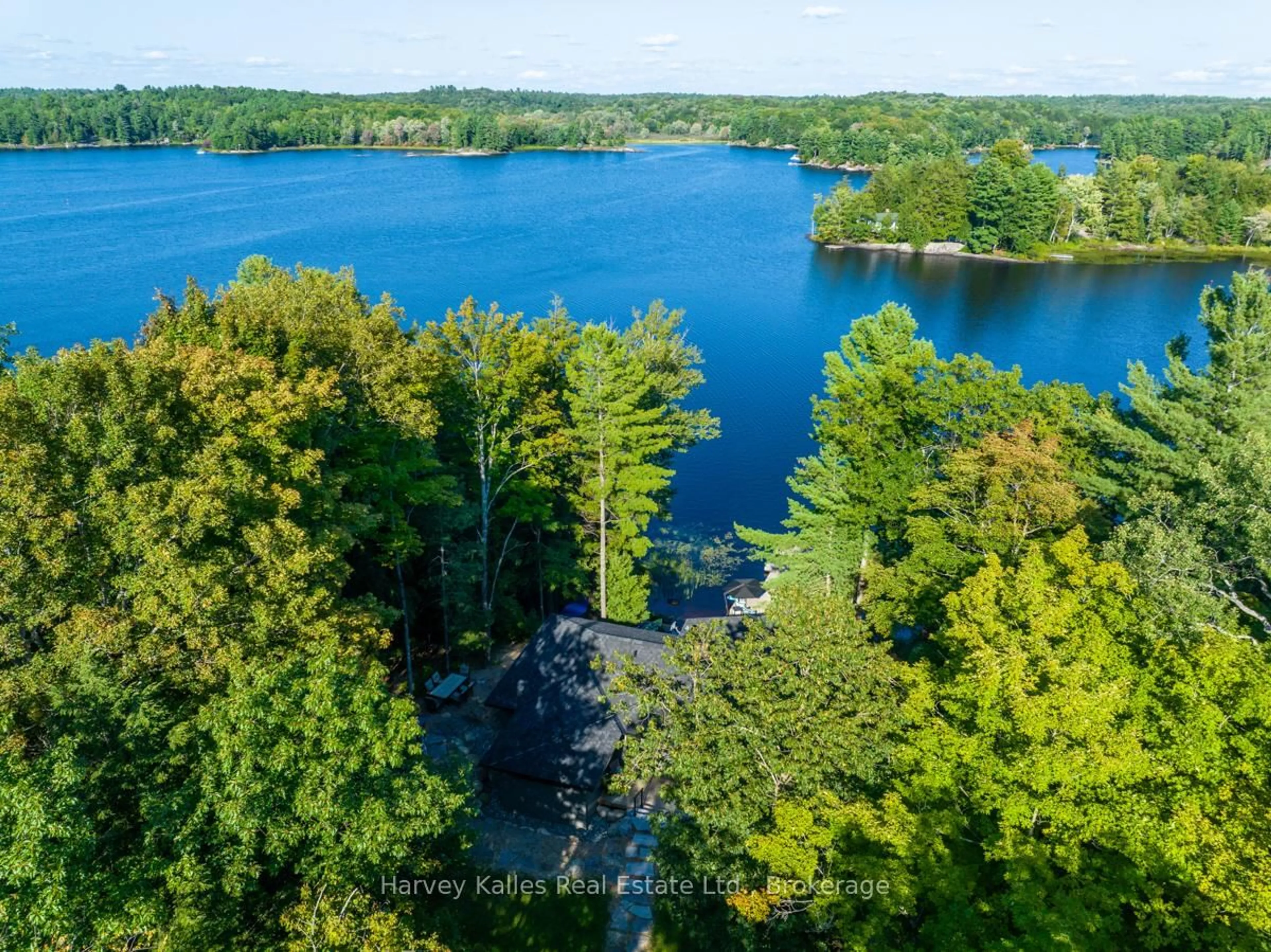A pic from outside/outdoor area/front of a property/back of a property/a pic from drone, water/lake/river/ocean view for 1035 Brandy Crest Rd ##16, Muskoka Lakes Ontario P0B 1J0