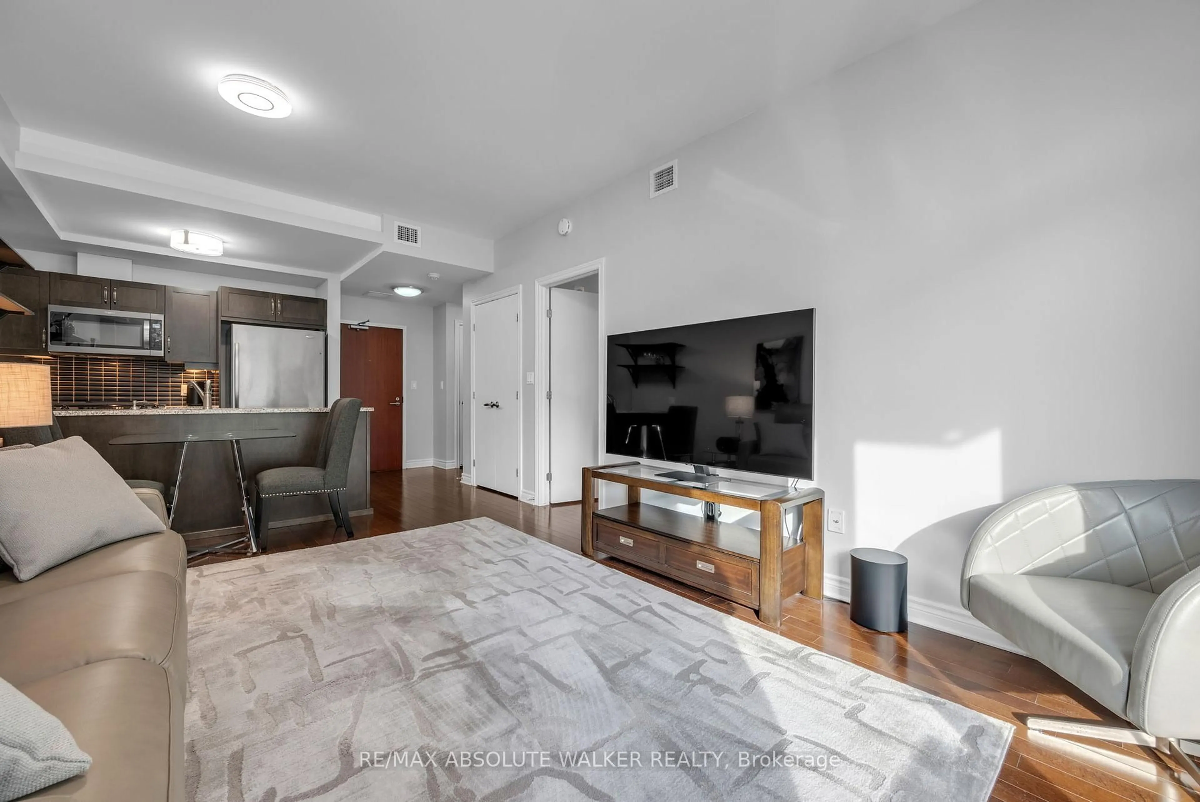 Living room with furniture, unknown for 575 Byron Ave #214, Ottawa Ontario K2A 1R7