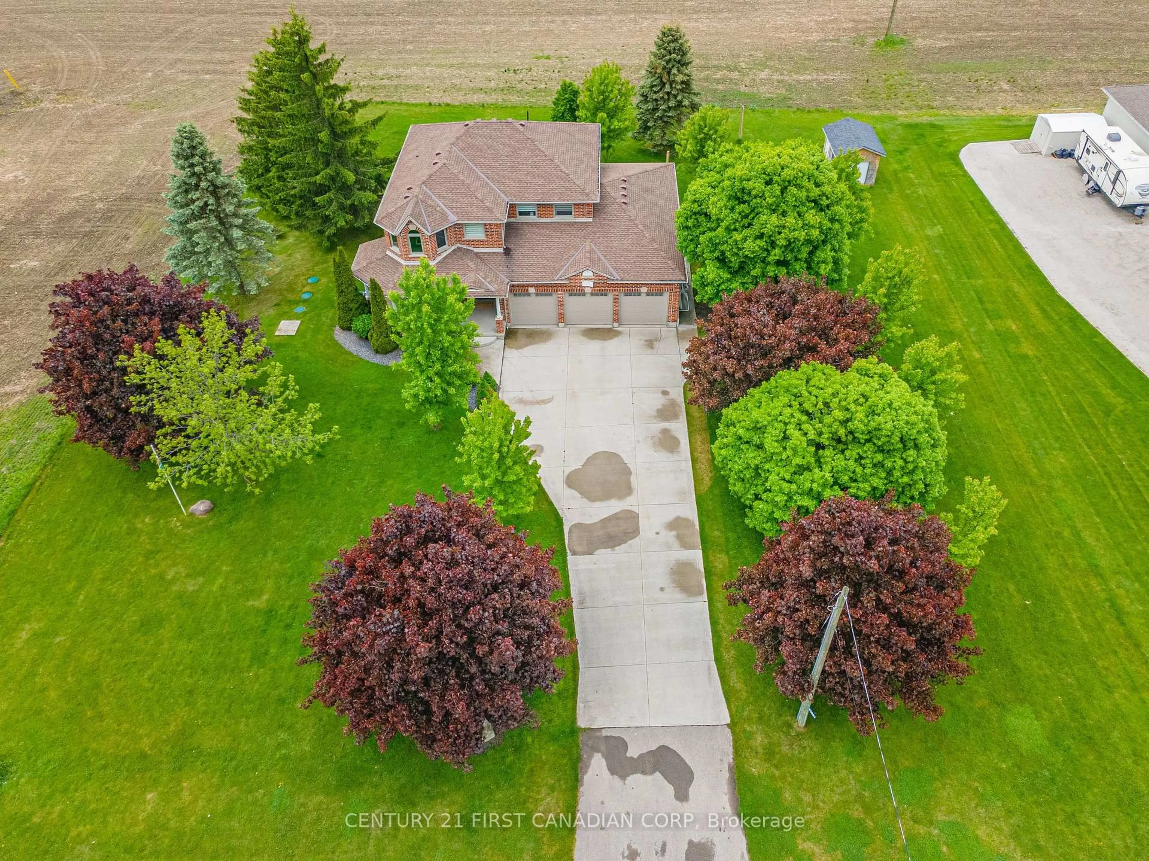 A pic from outside/outdoor area/front of a property/back of a property/a pic from drone, street for 23887 Denfield Rd, Middlesex Centre Ontario N0M 1P0