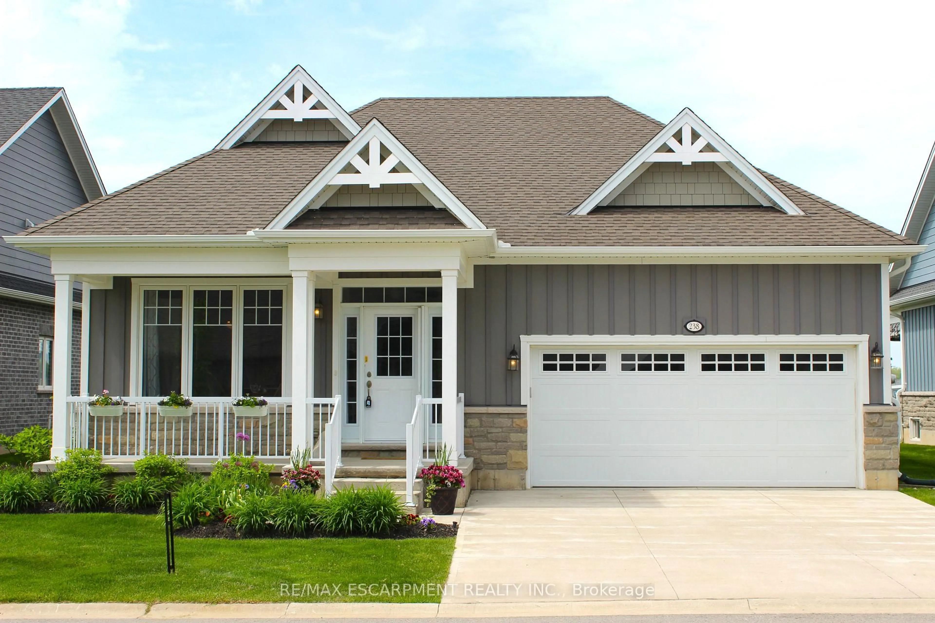 Home with vinyl exterior material, street for 238 SCHOONER Dr, Norfolk Ontario N0A 1N3