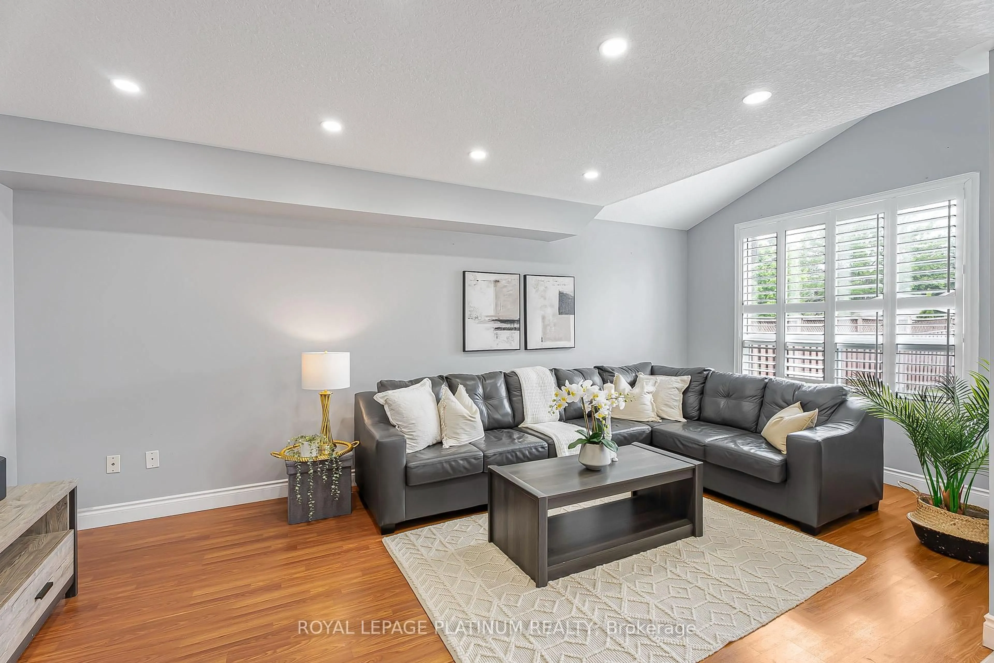 Living room with furniture, wood/laminate floor for 257 Grey Fox Dr, Kitchener Ontario N2E 3N7