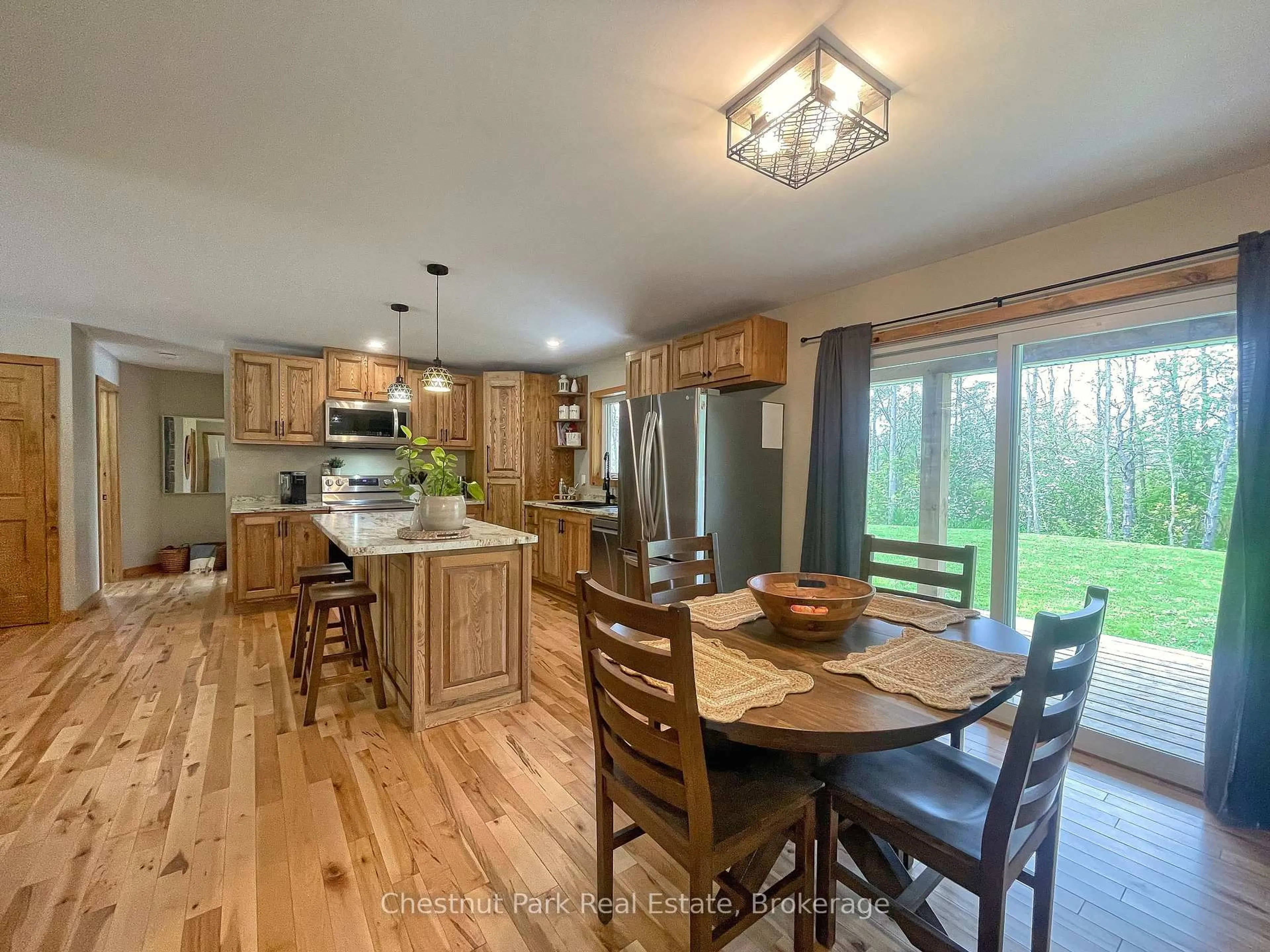 Open concept kitchen, wood/laminate floor for 23 Maple Dr, Northern Bruce Peninsula Ontario N0H 1Z0