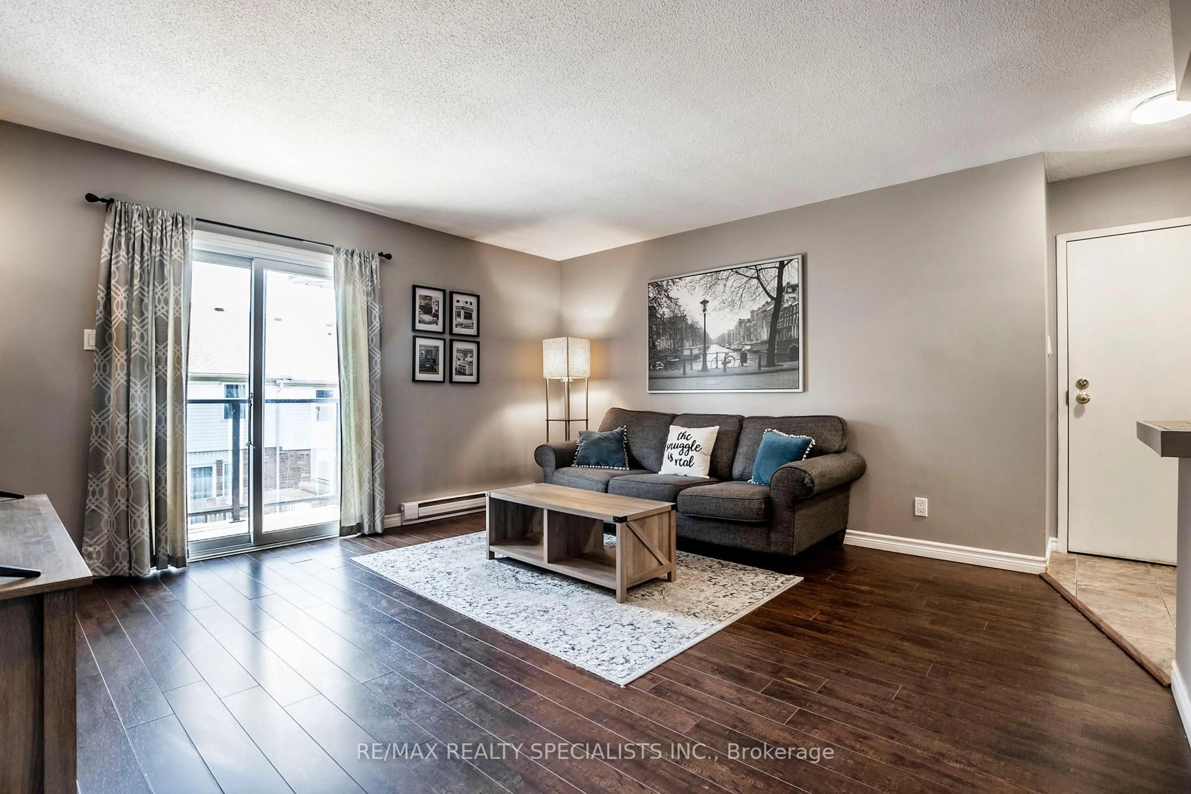 Living room with furniture, wood/laminate floor for 565 Greenfield Ave #410, Kitchener Ontario N2C 2P4