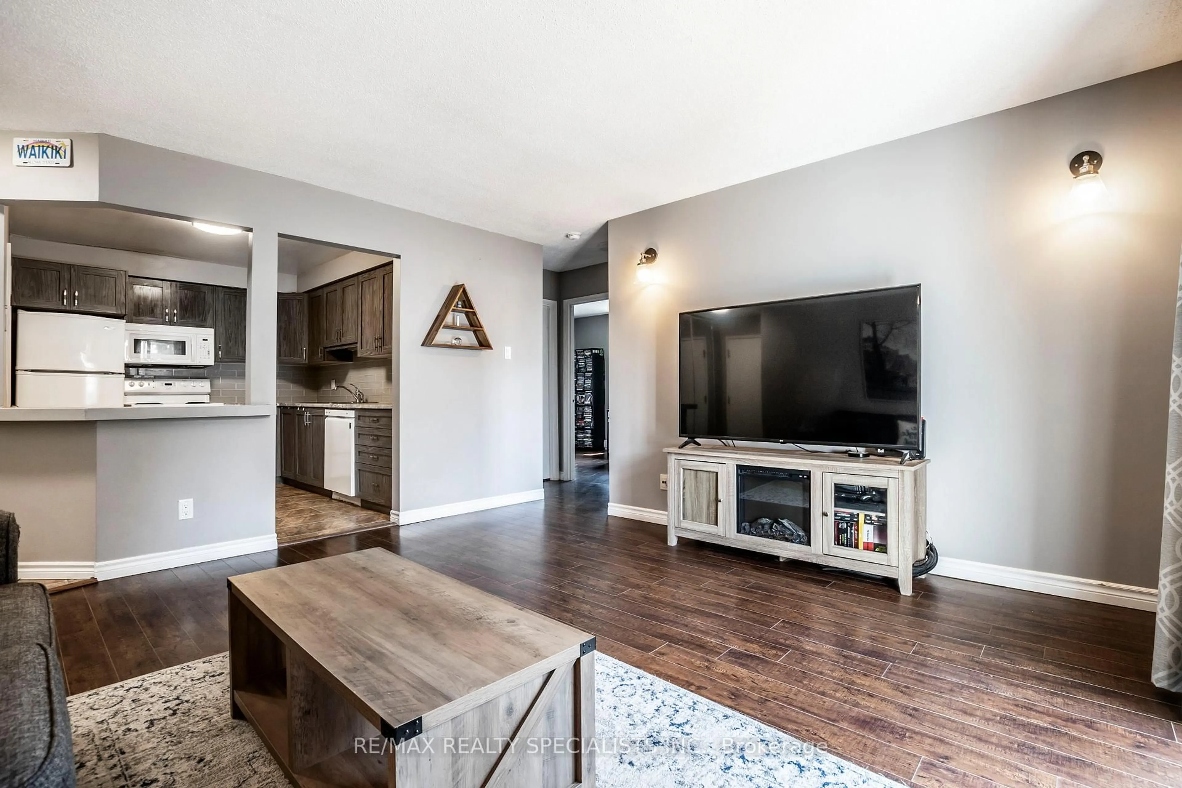 Living room with furniture, wood/laminate floor for 565 Greenfield Ave #410, Kitchener Ontario N2C 2P4