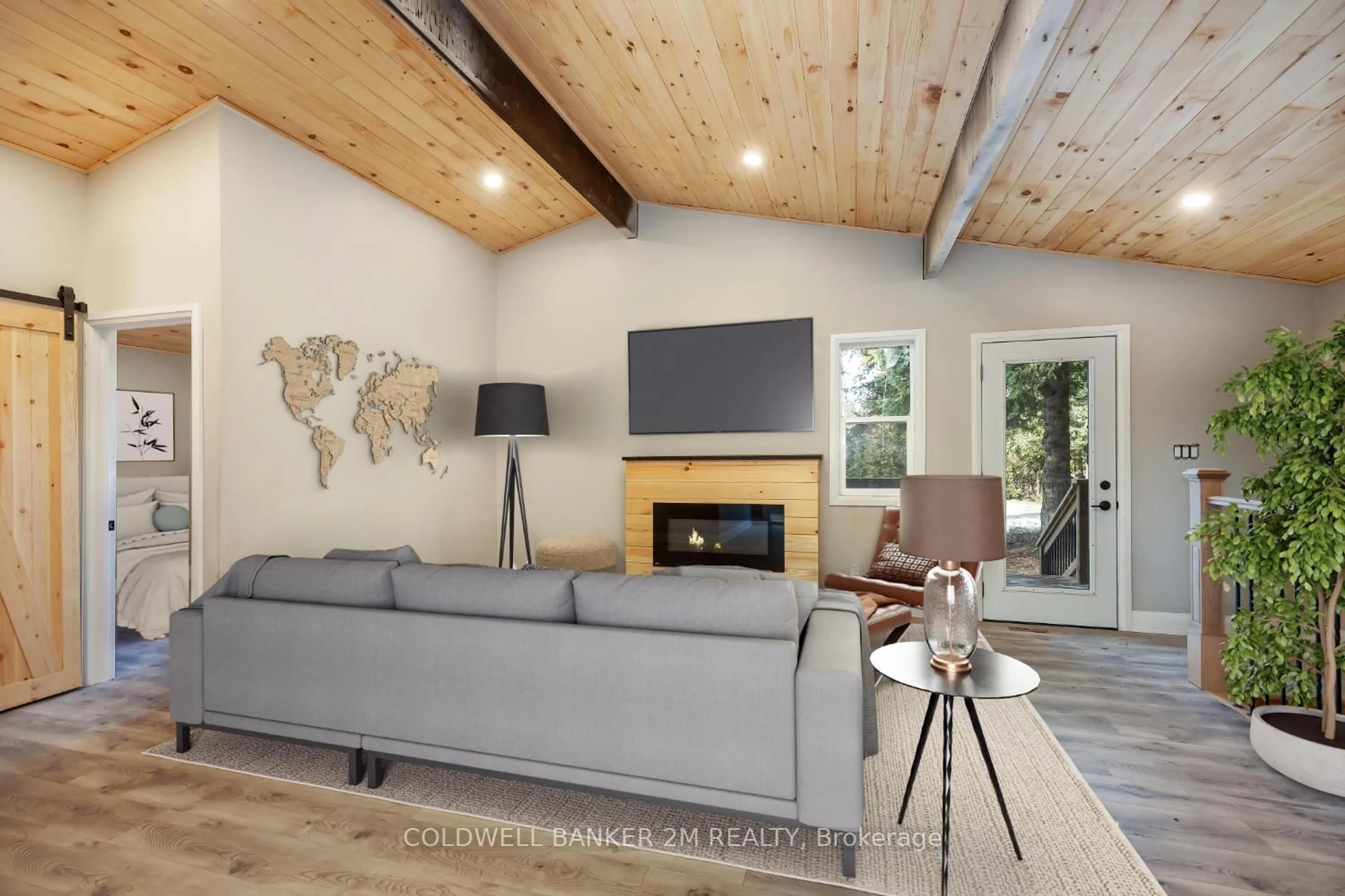 Living room with furniture, wood/laminate floor for 122 McGill Dr, Kawartha Lakes Ontario L0B 1K0