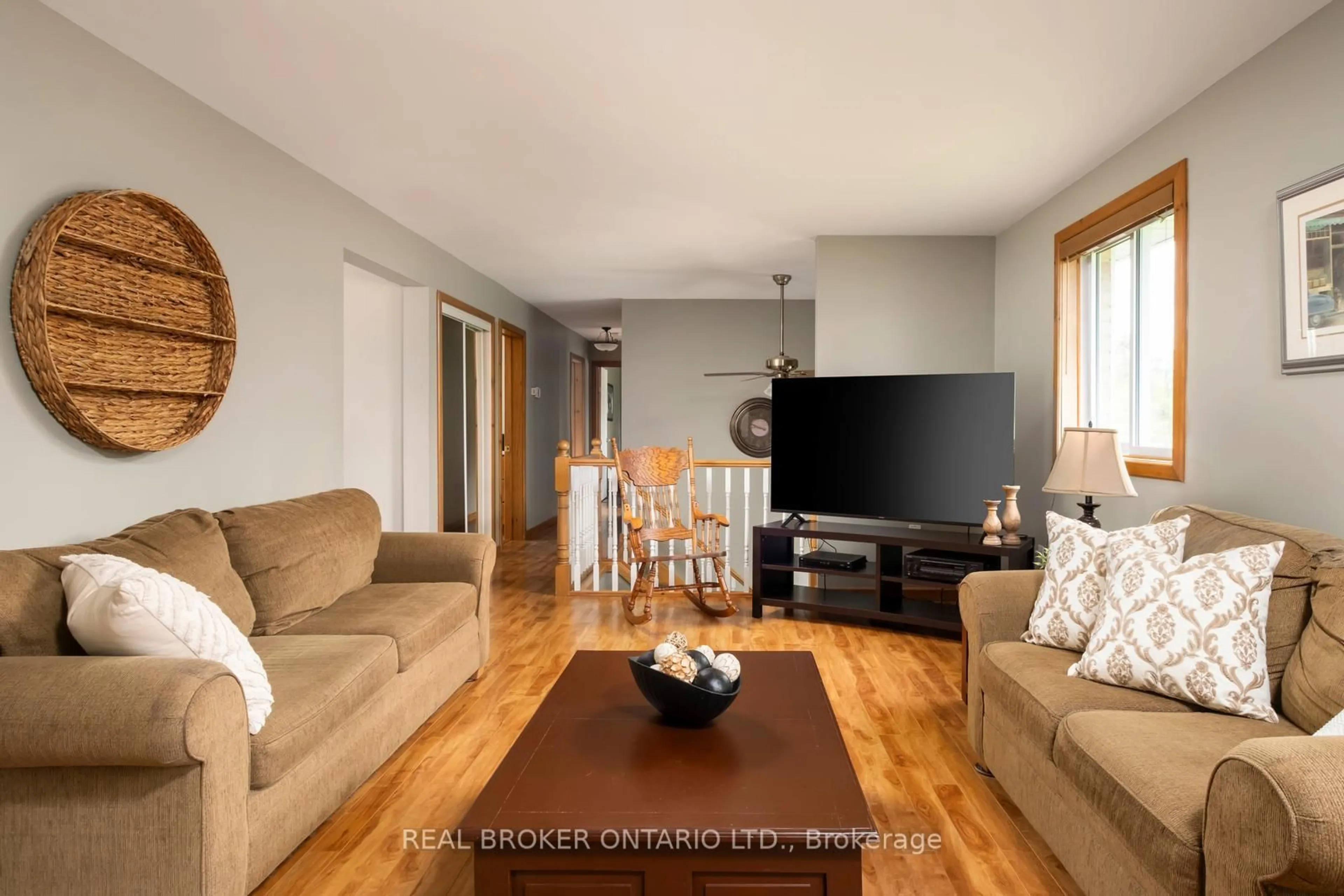 Living room with furniture, wood/laminate floor for 1743 Barton Dr, Selwyn Ontario K0L 2H0
