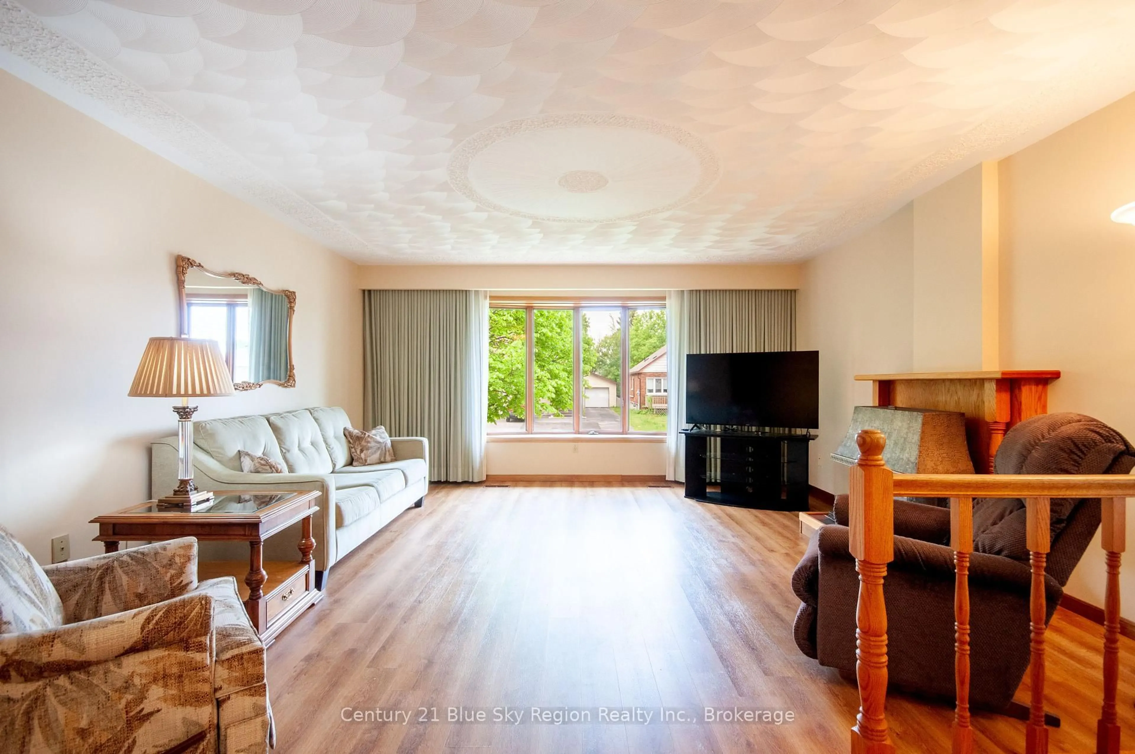 Living room with furniture, wood/laminate floor for 1328 Dale Ave, North Bay Ontario P1B 6V6