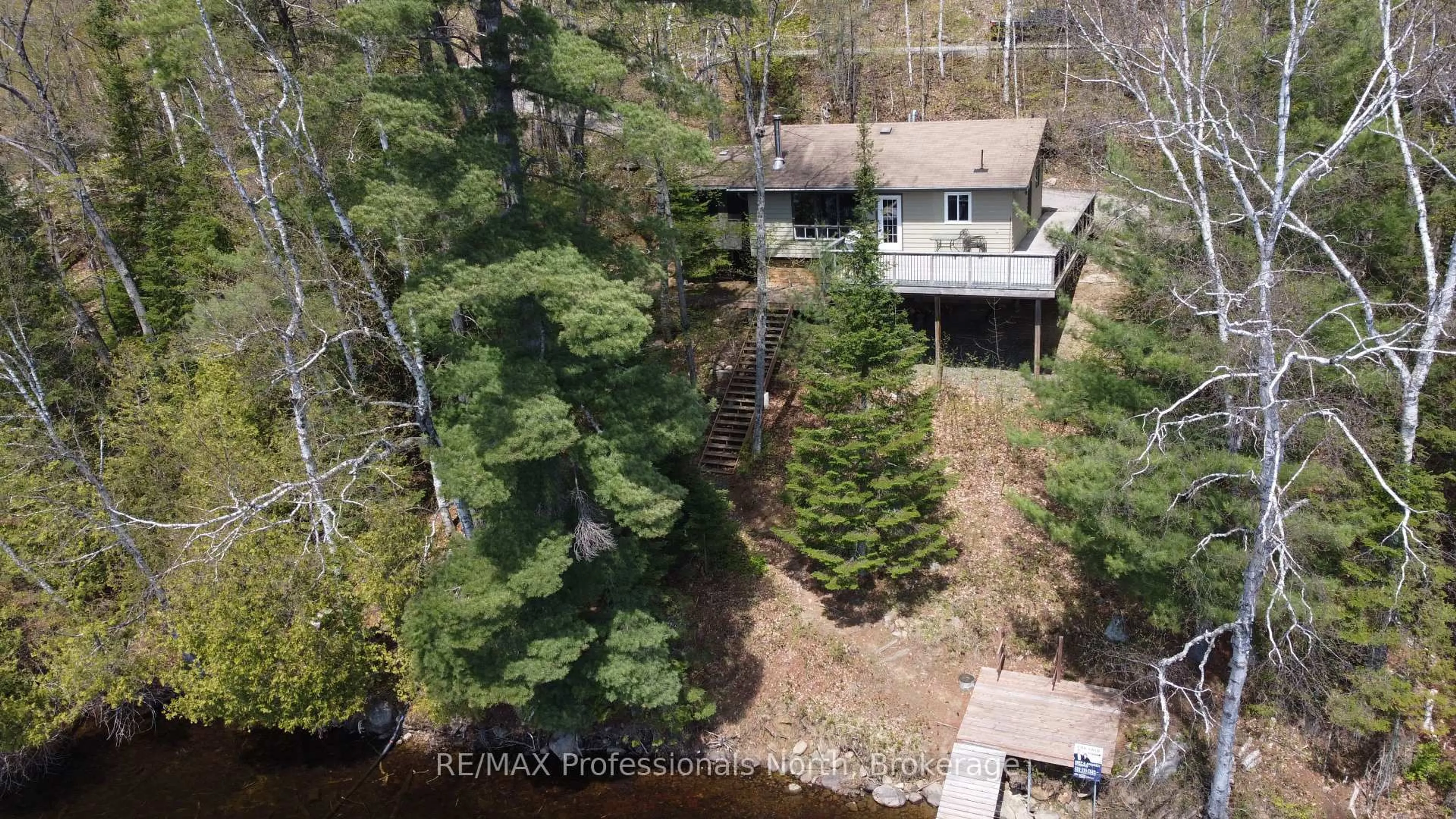 A pic from outside/outdoor area/front of a property/back of a property/a pic from drone, water/lake/river/ocean view for 1196 Portage Rd, Dysart et al Ontario K0M 1S0