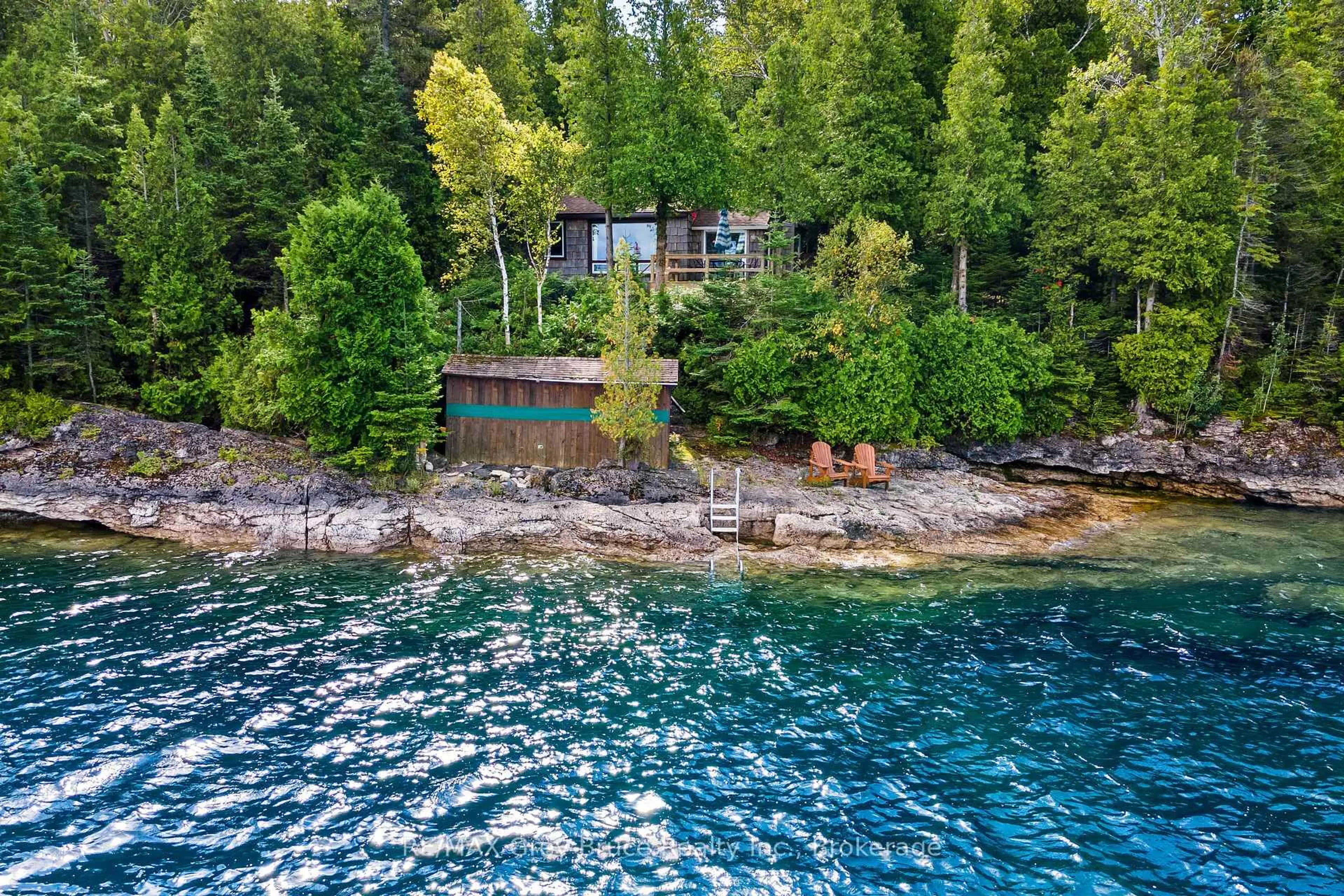 A pic from outside/outdoor area/front of a property/back of a property/a pic from drone, water/lake/river/ocean view for 70 Big Tub Rd, Northern Bruce Peninsula Ontario N0H 2R0