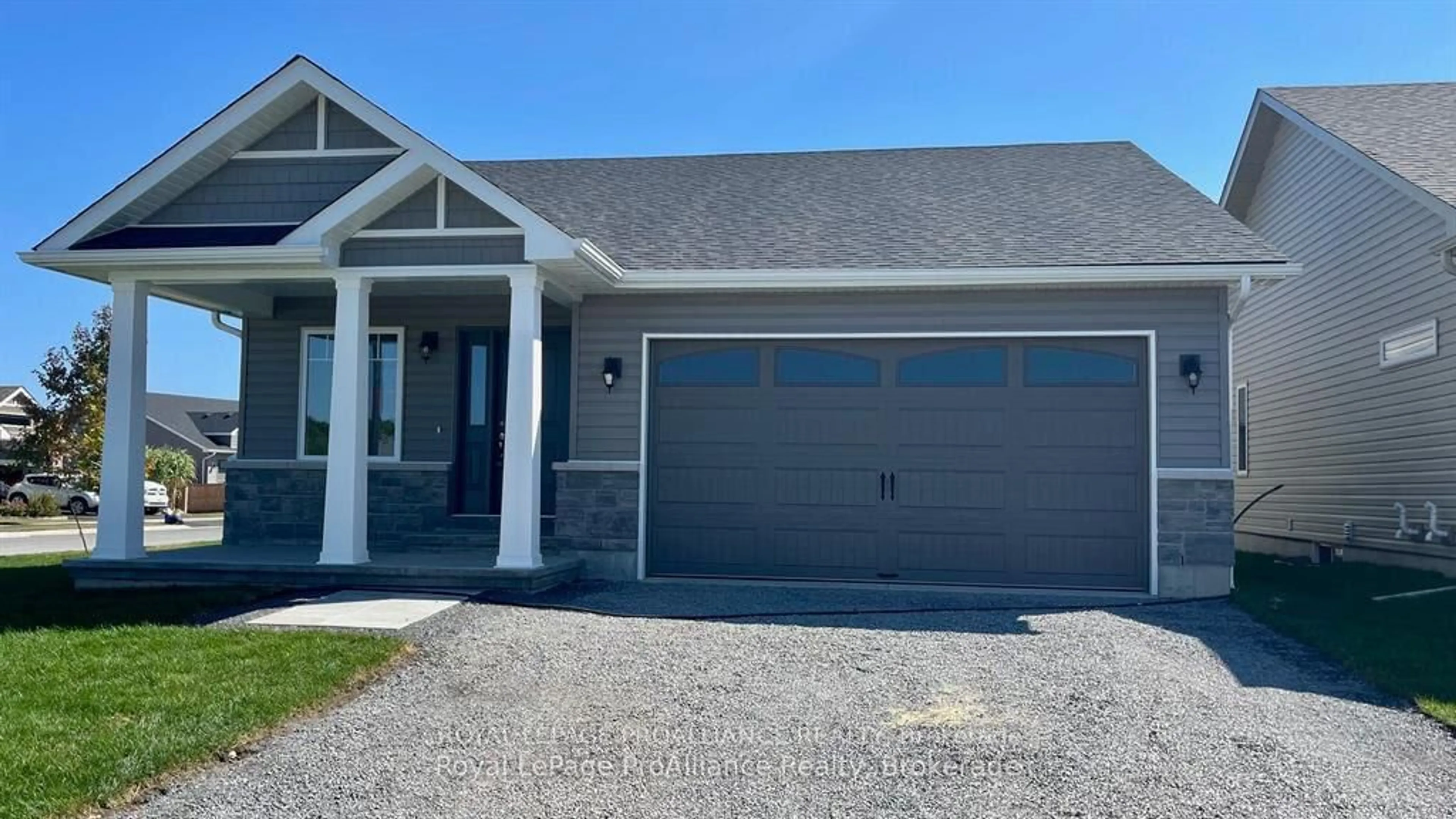 Home with vinyl exterior material, street for 70 Stirling Cres, Prince Edward County Ontario K0K 2T0