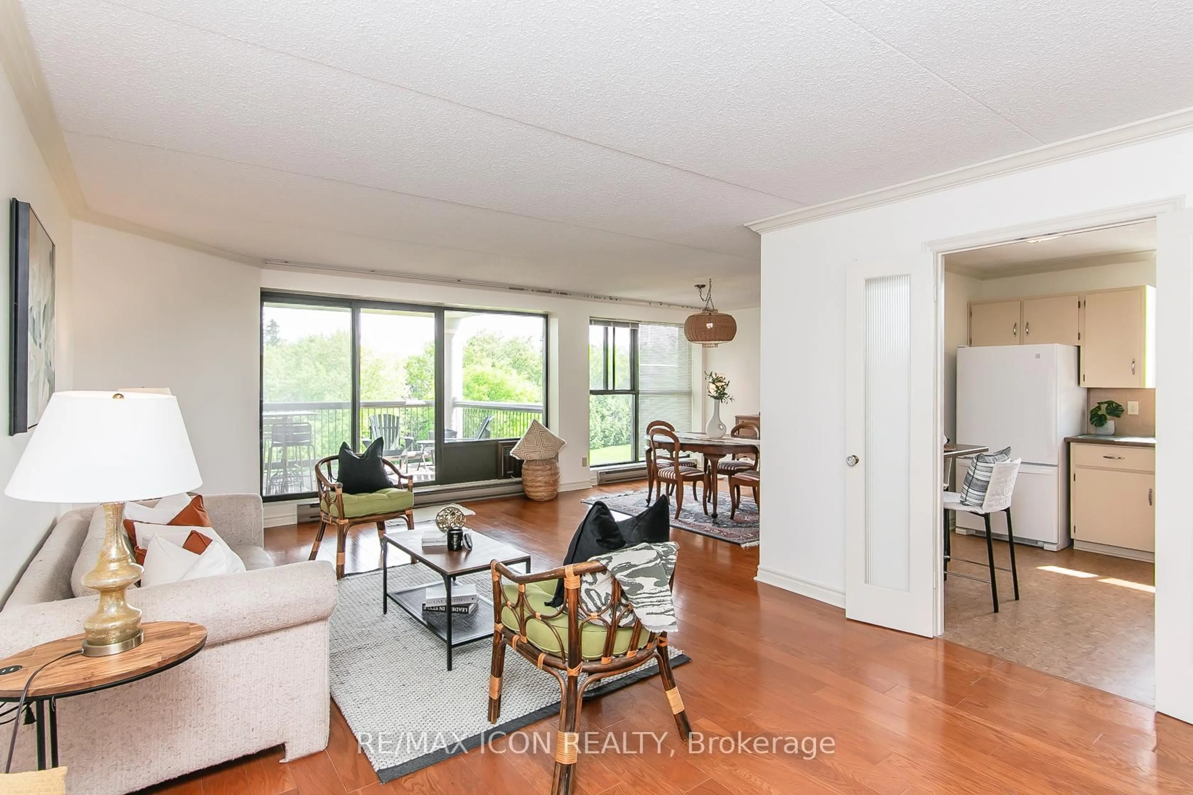 Living room with furniture, wood/laminate floor for 22 Marilyn Dr #508, Guelph Ontario N1H 7T1