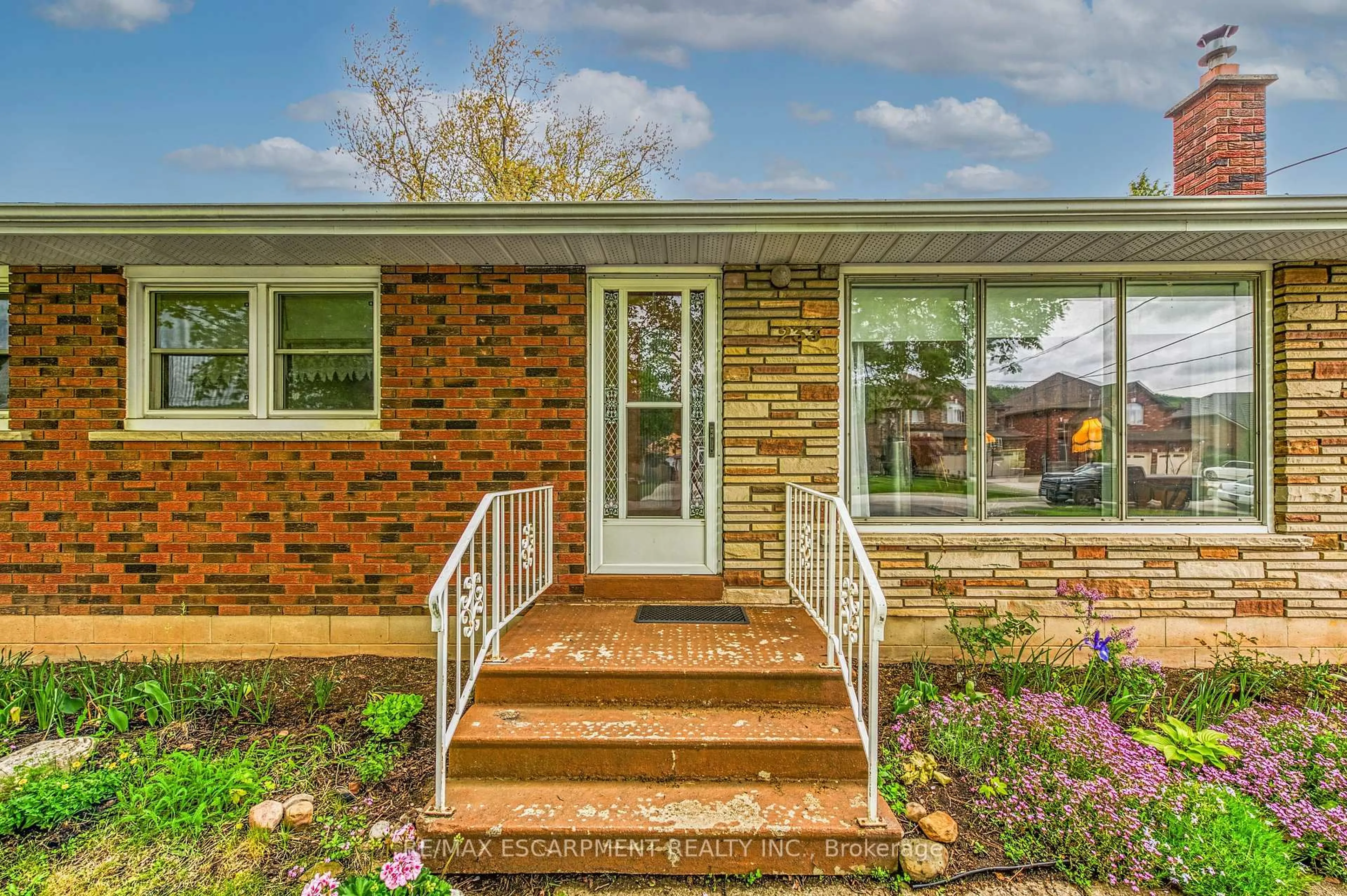 Home with brick exterior material, street for 233 Helena Ave, Hamilton Ontario L8E 5K1