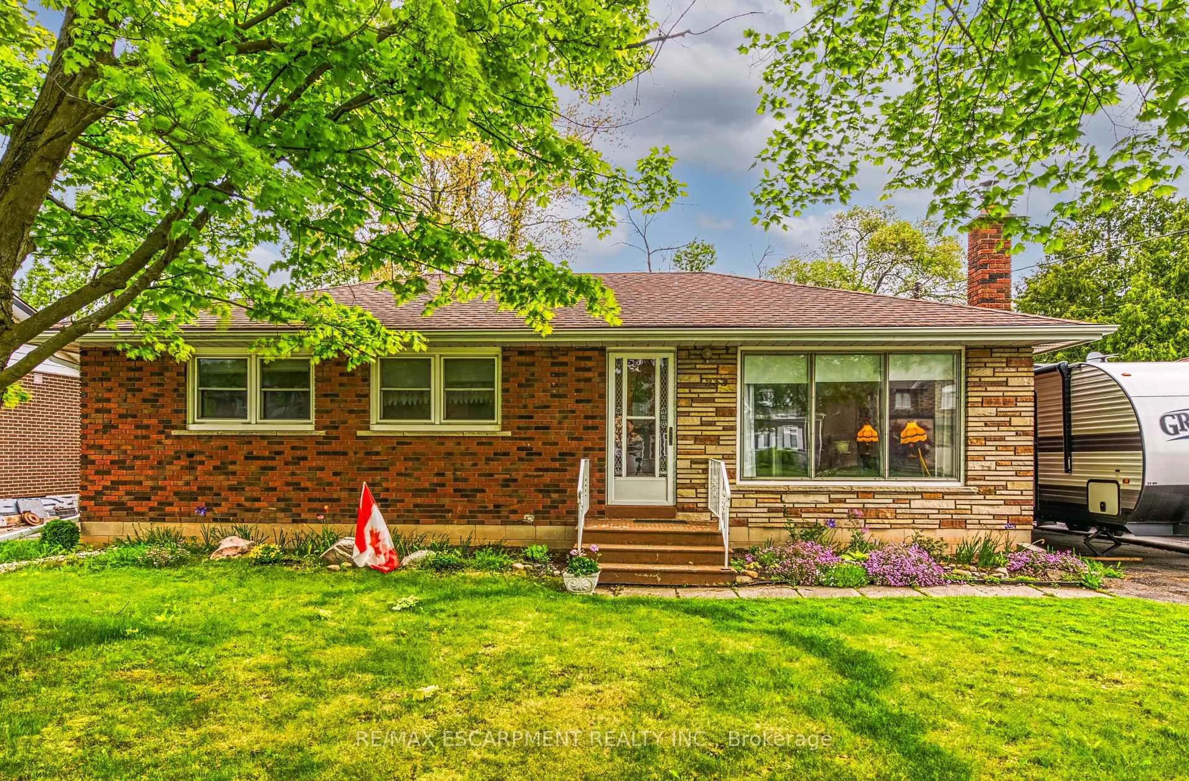 Home with brick exterior material, street for 233 Helena Ave, Hamilton Ontario L8E 5K1