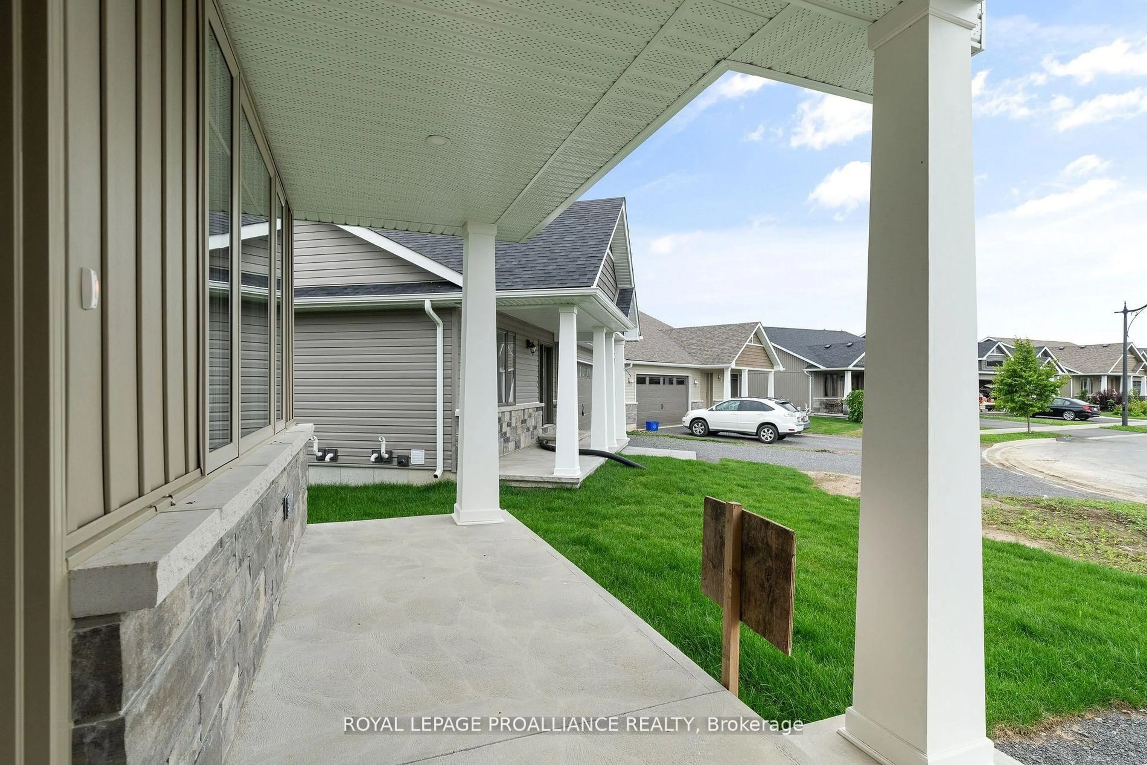 Home with vinyl exterior material, street for 72 Stirling Cres, Prince Edward County Ontario K0K 2T0