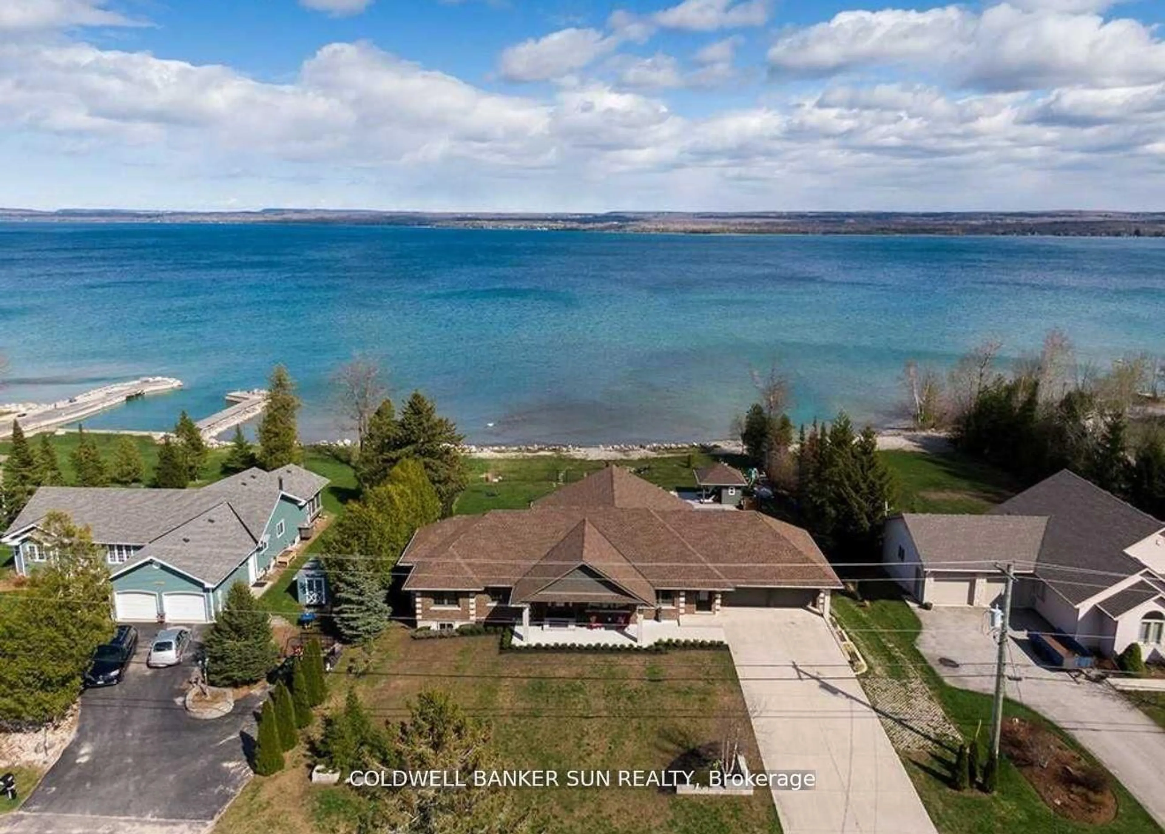 A pic from outside/outdoor area/front of a property/back of a property/a pic from drone, water/lake/river/ocean view for 197 Balmy Beach Rd, Georgian Bluffs Ontario N4K 5N4