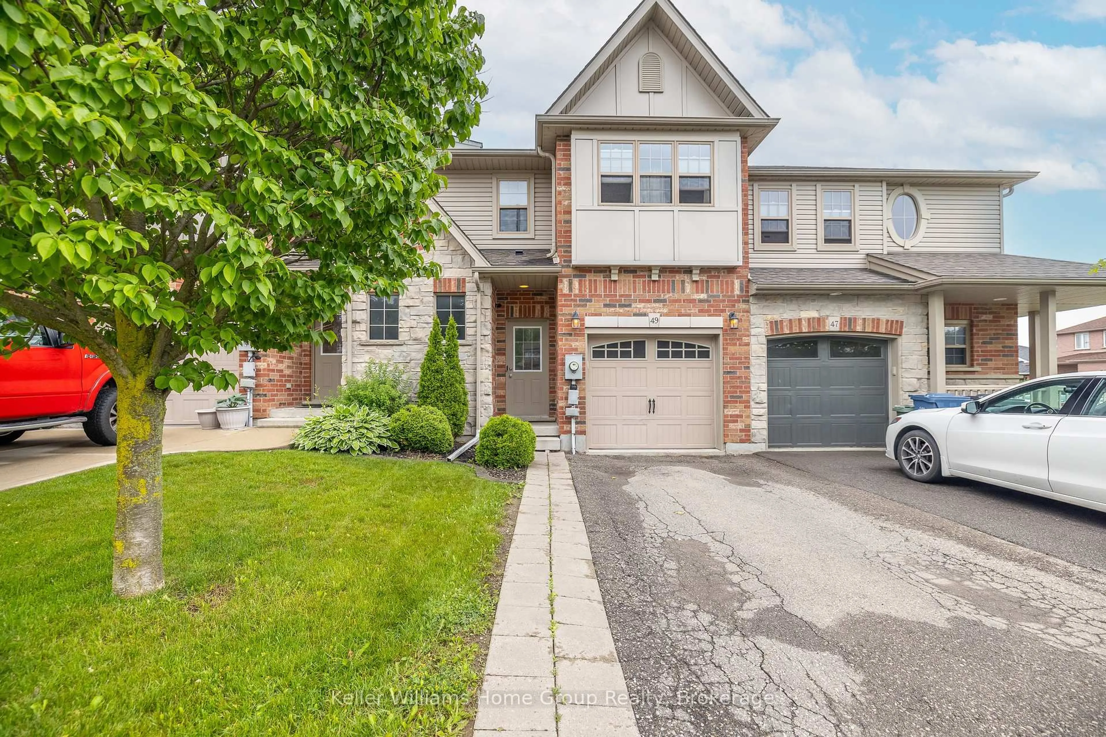 Home with brick exterior material, street for 49 WASHBURN Dr, Guelph Ontario N1E 0B2