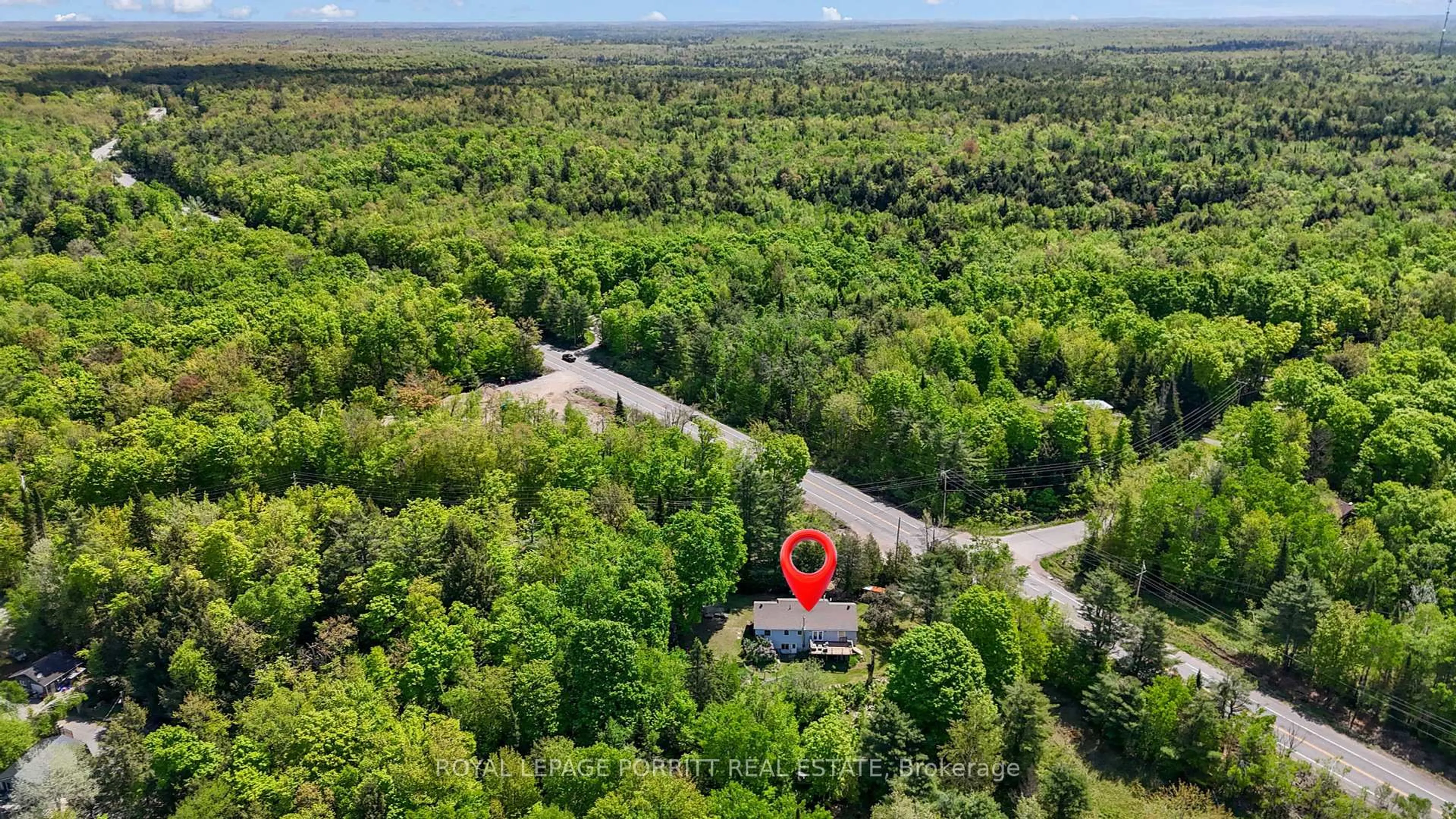A pic from outside/outdoor area/front of a property/back of a property/a pic from drone, forest/trees view for 1101 Hawn Rd, Bracebridge Ontario P1L 1X1