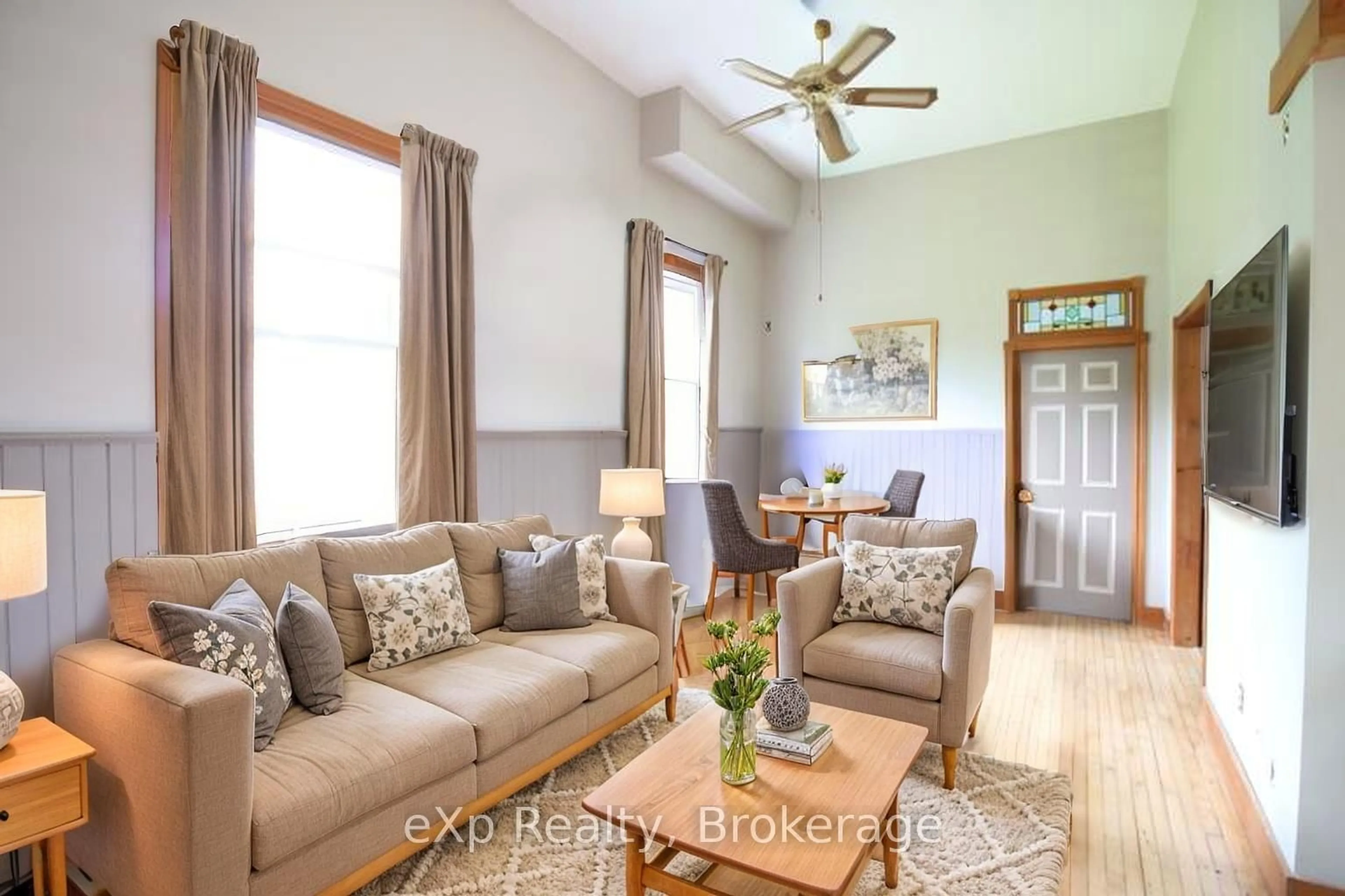 Living room with furniture, wood/laminate floor for 735125 West Back Line, West Grey Ontario N0C 1H0