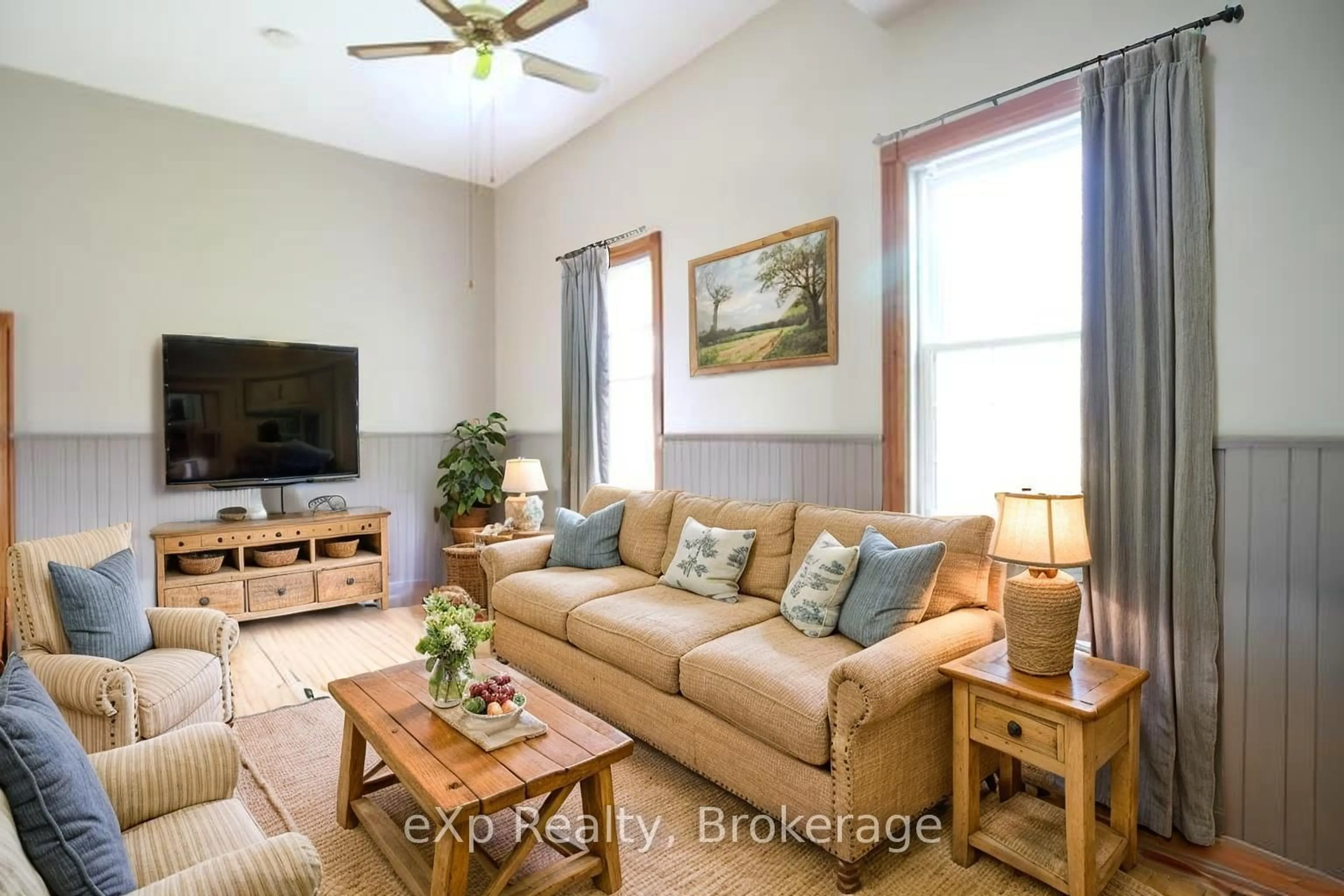 Living room with furniture, wood/laminate floor for 735125 West Back Line, West Grey Ontario N0C 1H0
