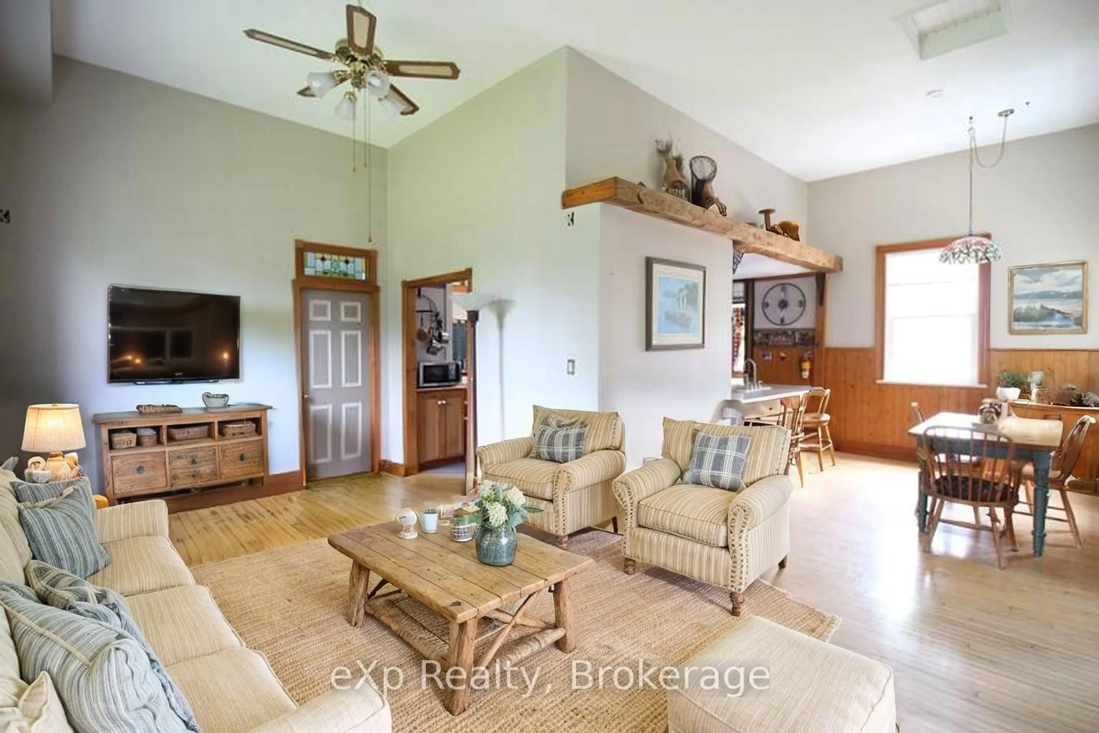 Living room with furniture, wood/laminate floor for 735125 West Back Line, West Grey Ontario N0C 1H0