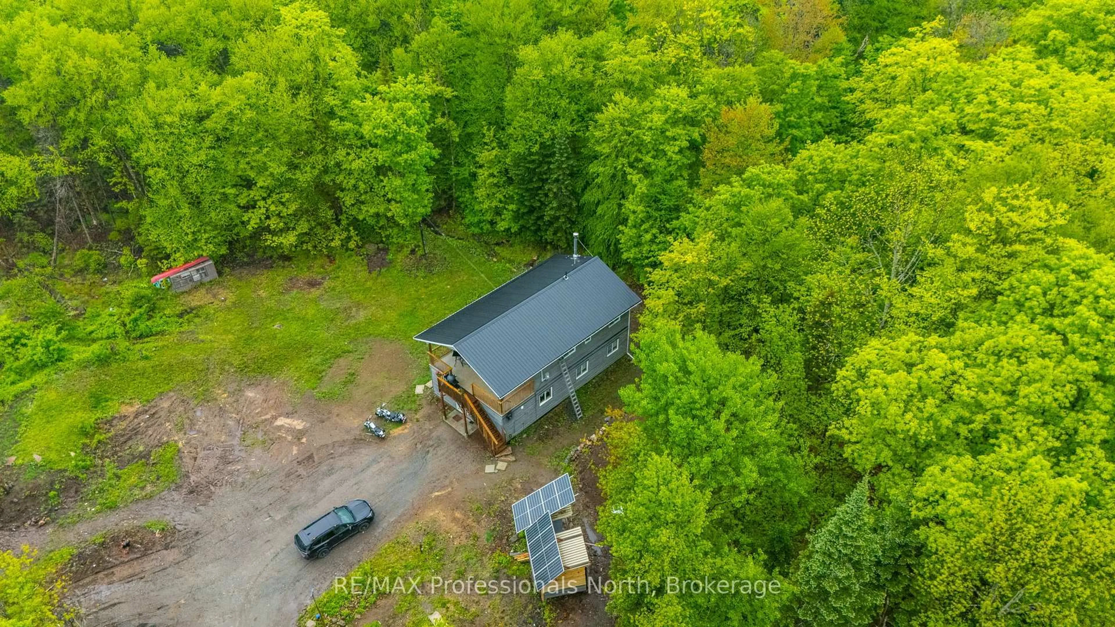 A pic from outside/outdoor area/front of a property/back of a property/a pic from drone, forest/trees view for 18240 Highway 118 Highway, Highlands East Ontario K0L 2Y0
