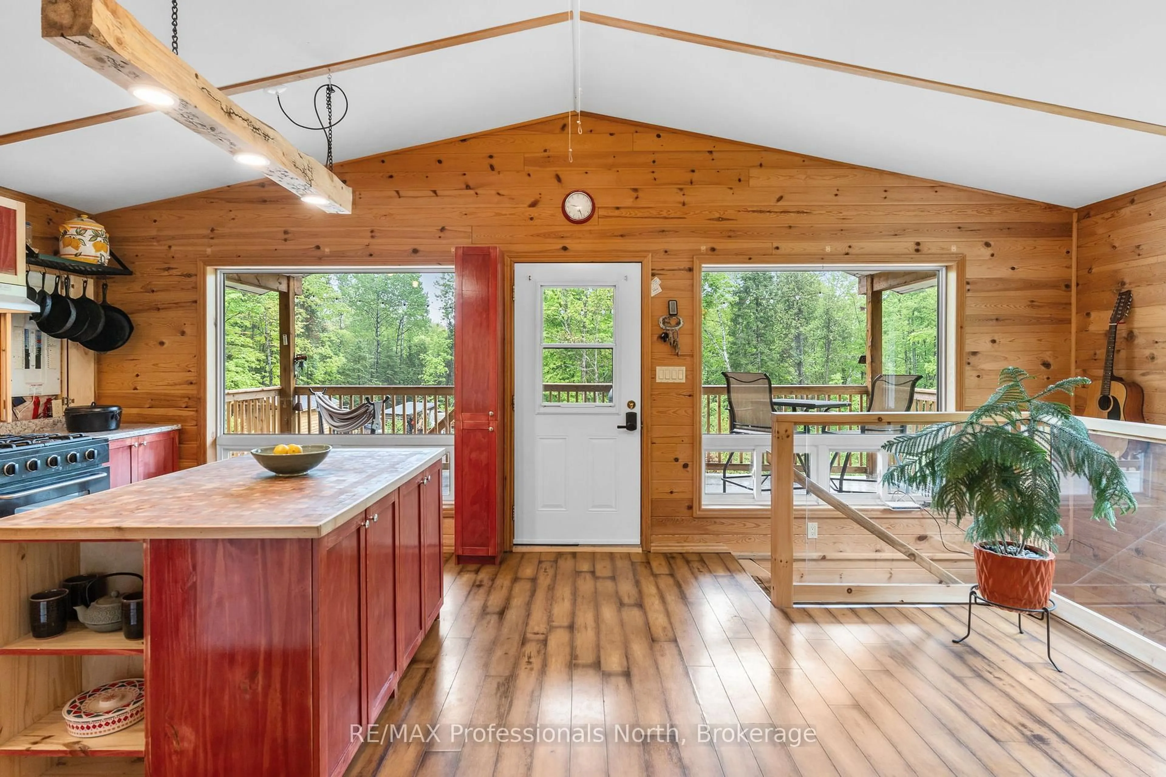 Open concept kitchen, wood/laminate floor for 18240 Highway 118 Highway, Highlands East Ontario K0L 2Y0