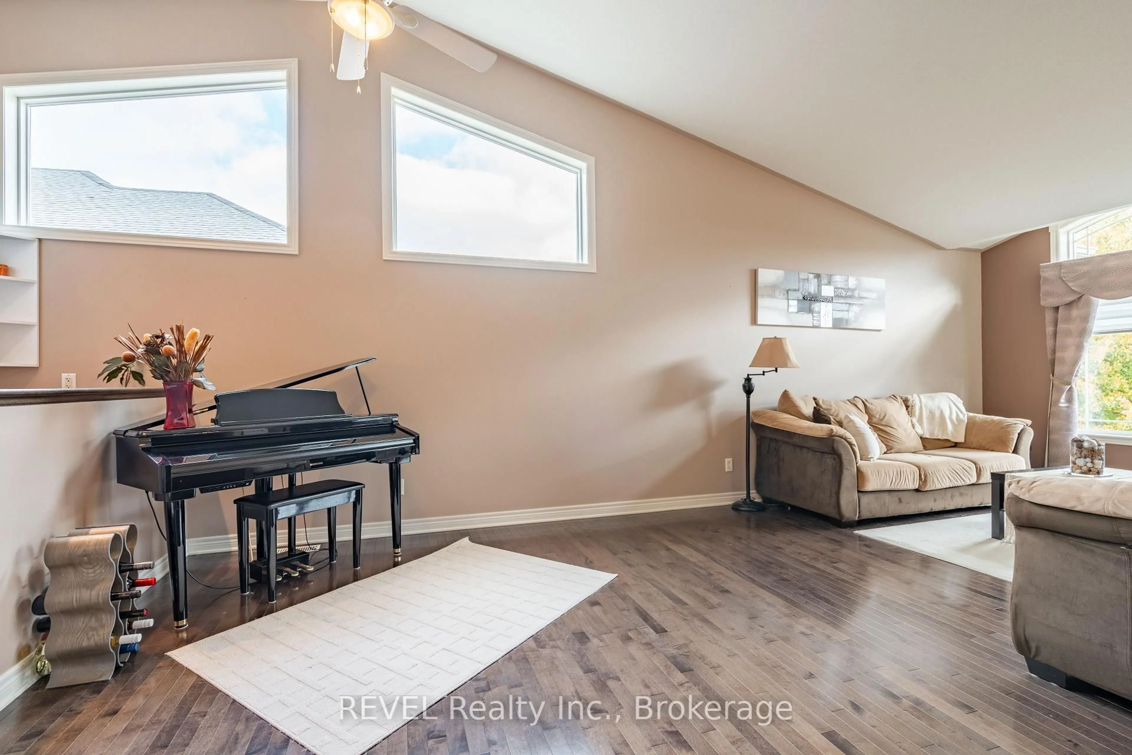 Living room with furniture, wood/laminate floor for 8503 Greenfield Cres, Niagara Falls Ontario L2H 3J8