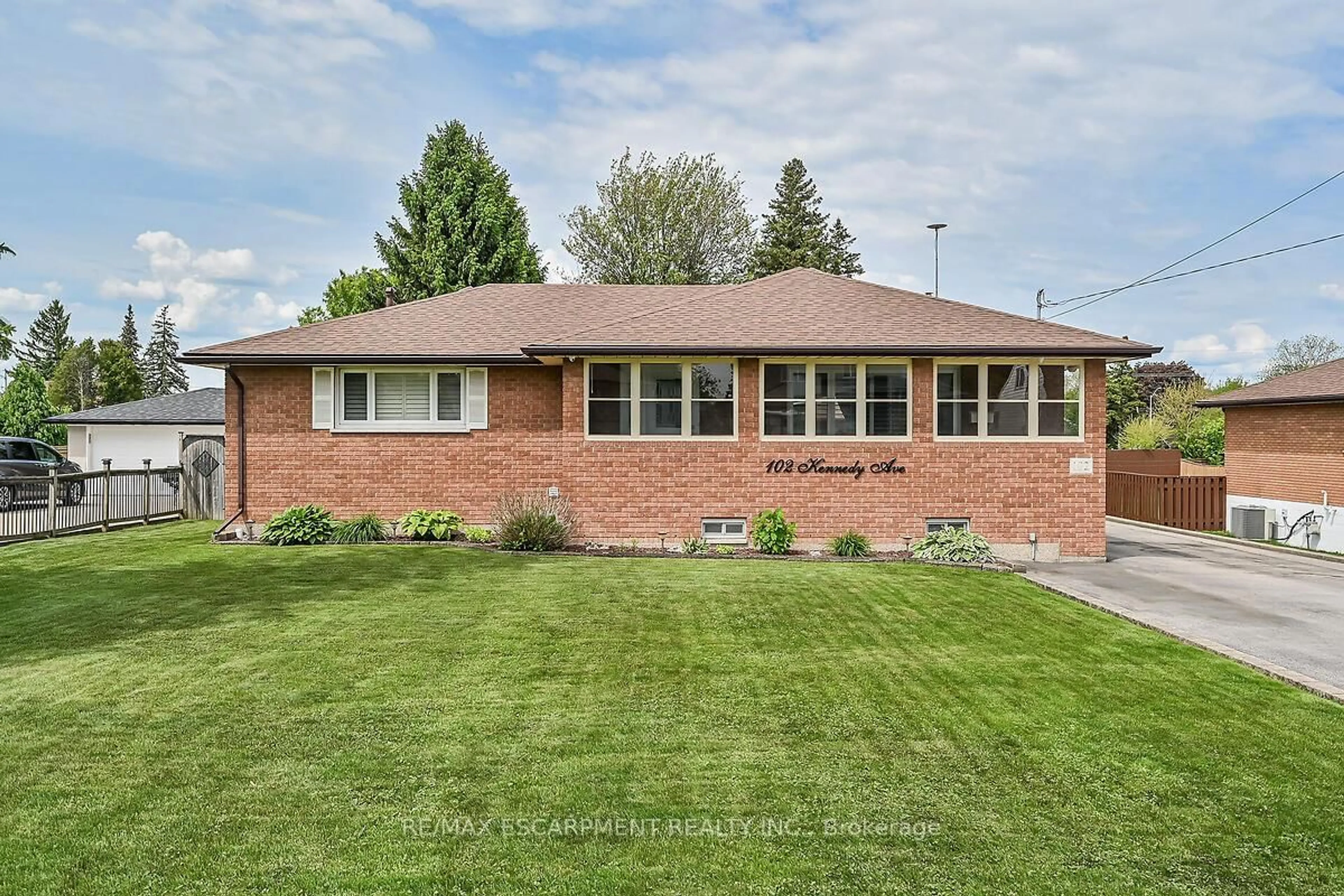 Home with brick exterior material, street for 102 Kennedy Ave, Hamilton Ontario L9B 1C7