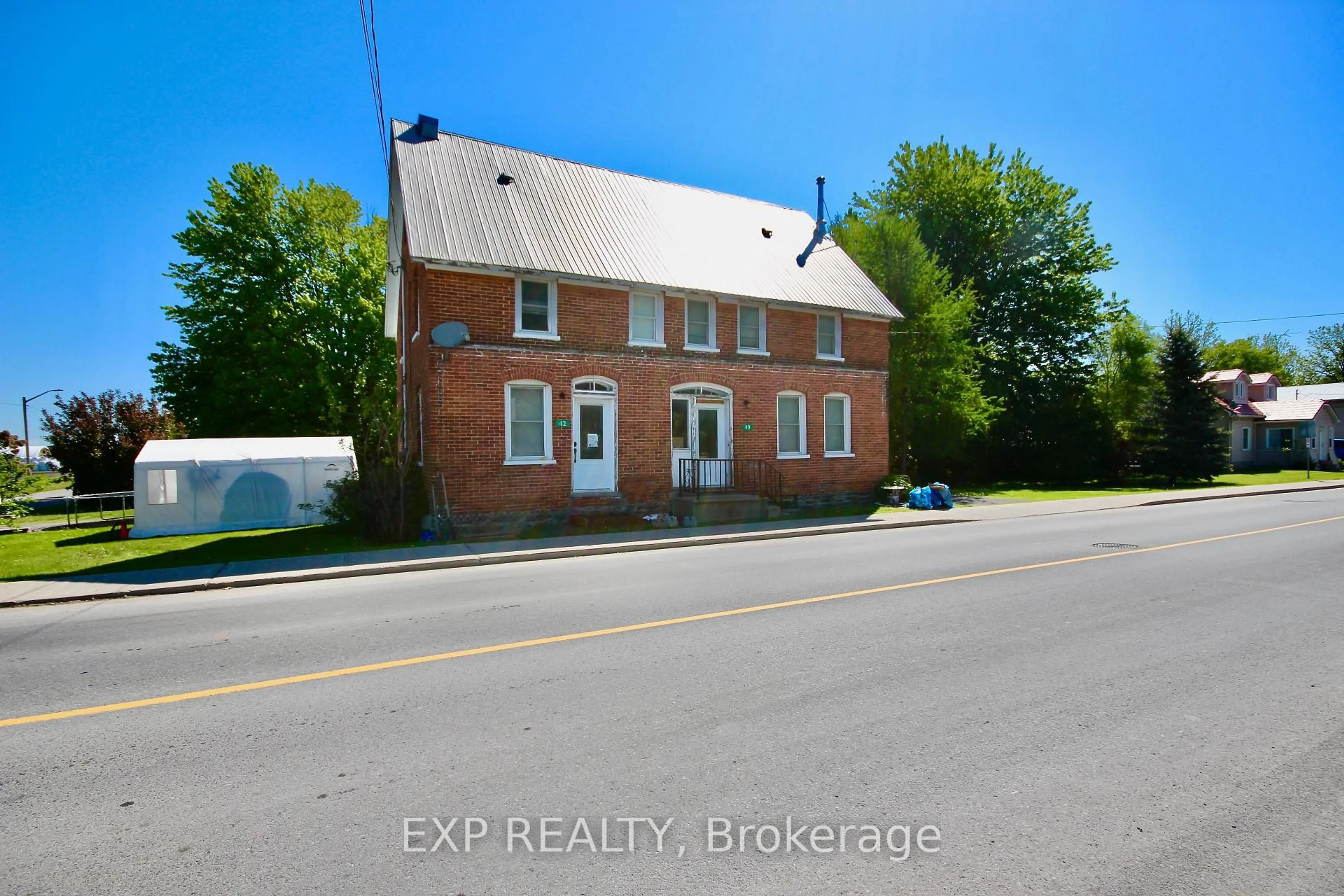 A pic from outside/outdoor area/front of a property/back of a property/a pic from drone, building for 40 Main St #40 & 42, North Stormont Ontario K0C 0B2