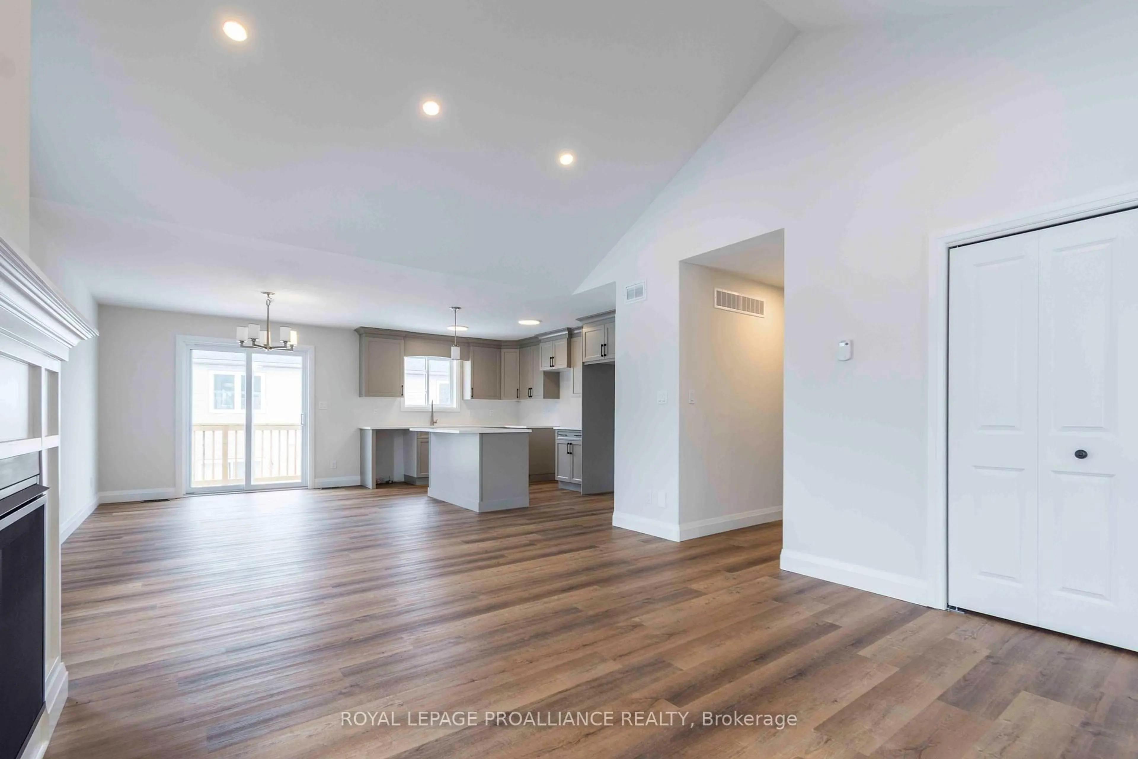 Open concept kitchen, wood/laminate floor for 74 Stirling Cres, Prince Edward County Ontario K0K 2T0