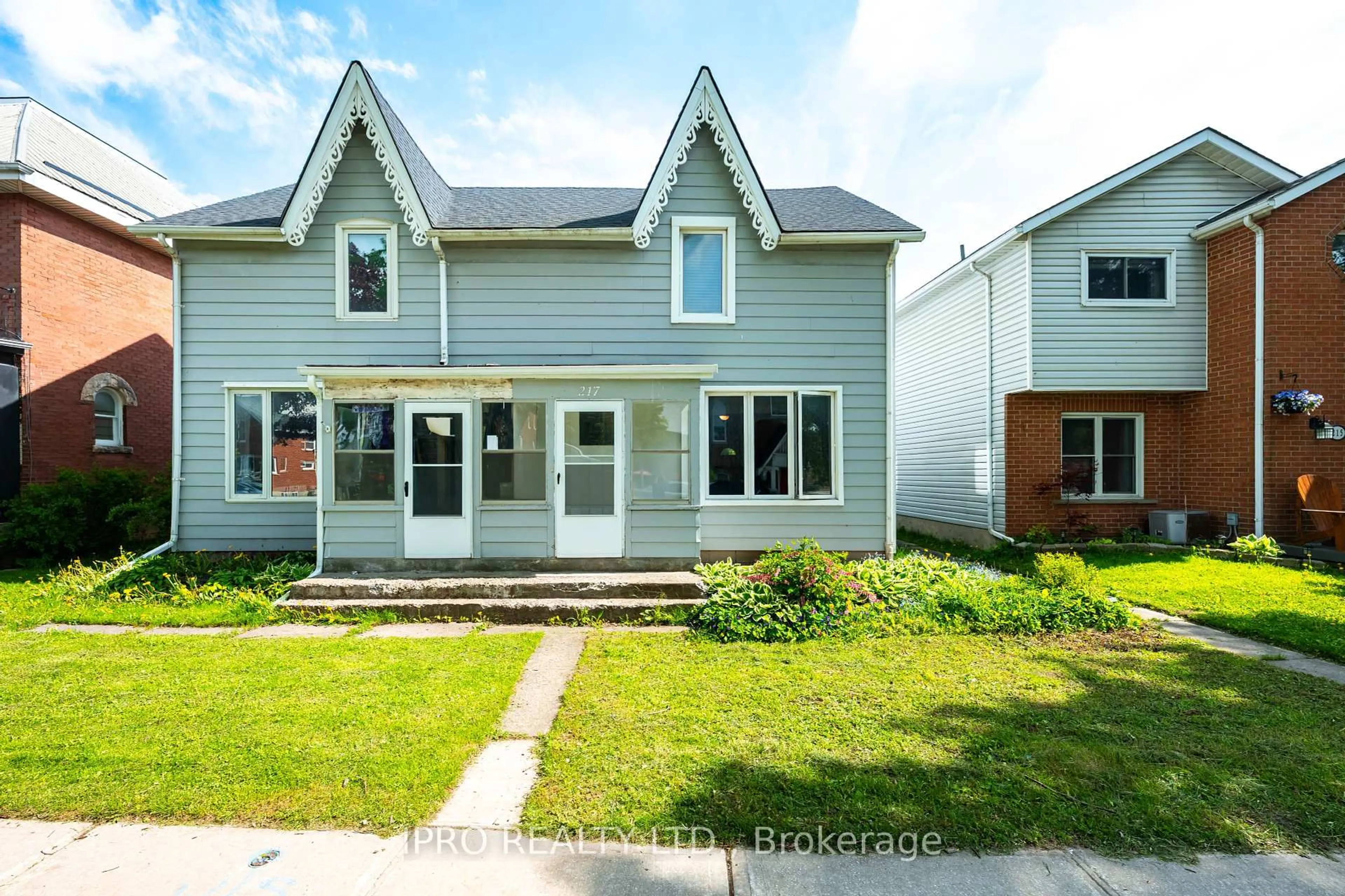 Home with vinyl exterior material, street for 217 Main St, Shelburne Ontario L0N 1S3