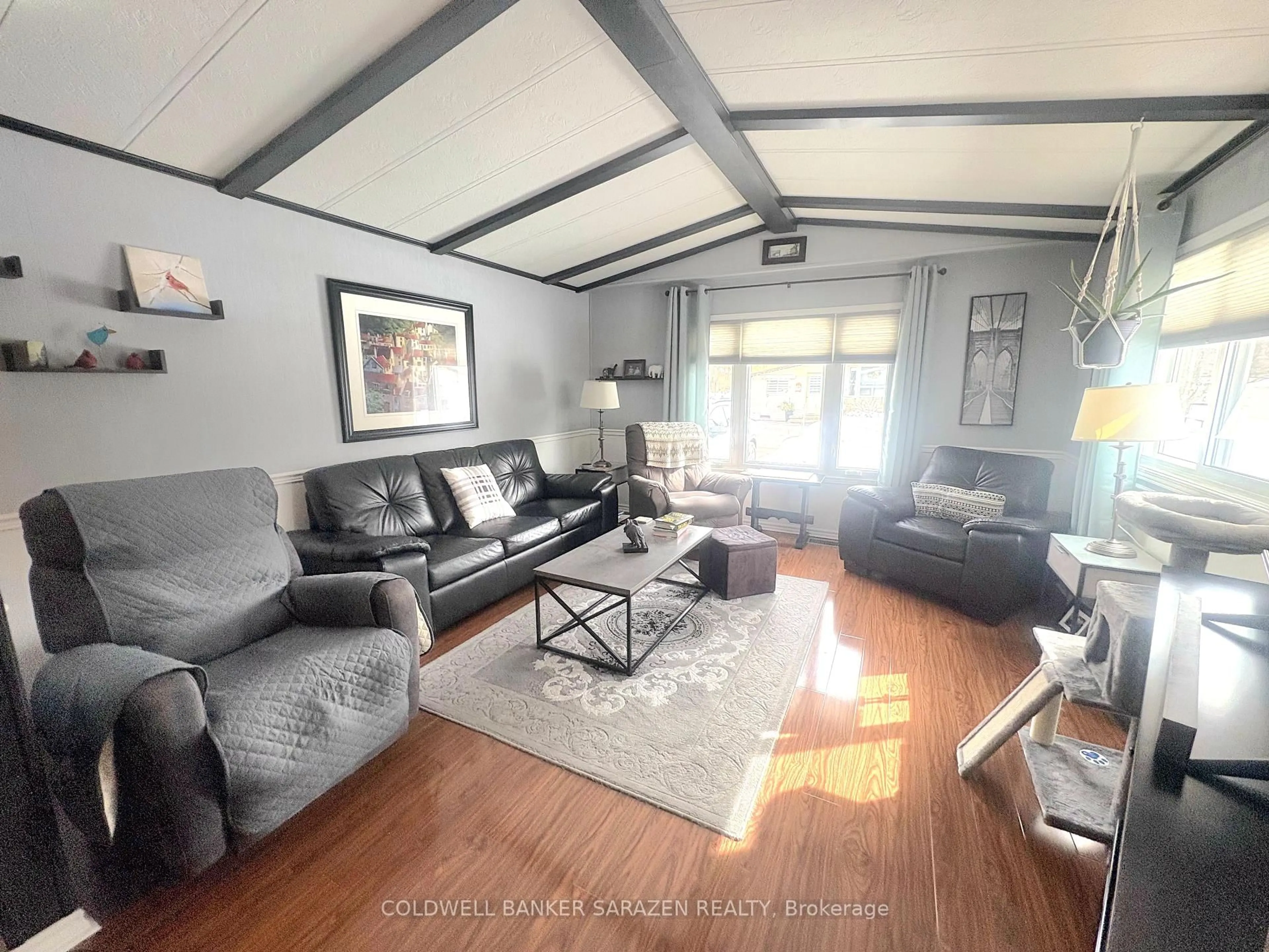 Living room with furniture, wood/laminate floor for 35 Evergreen Lane, White Lake Ontario K0A 3L0