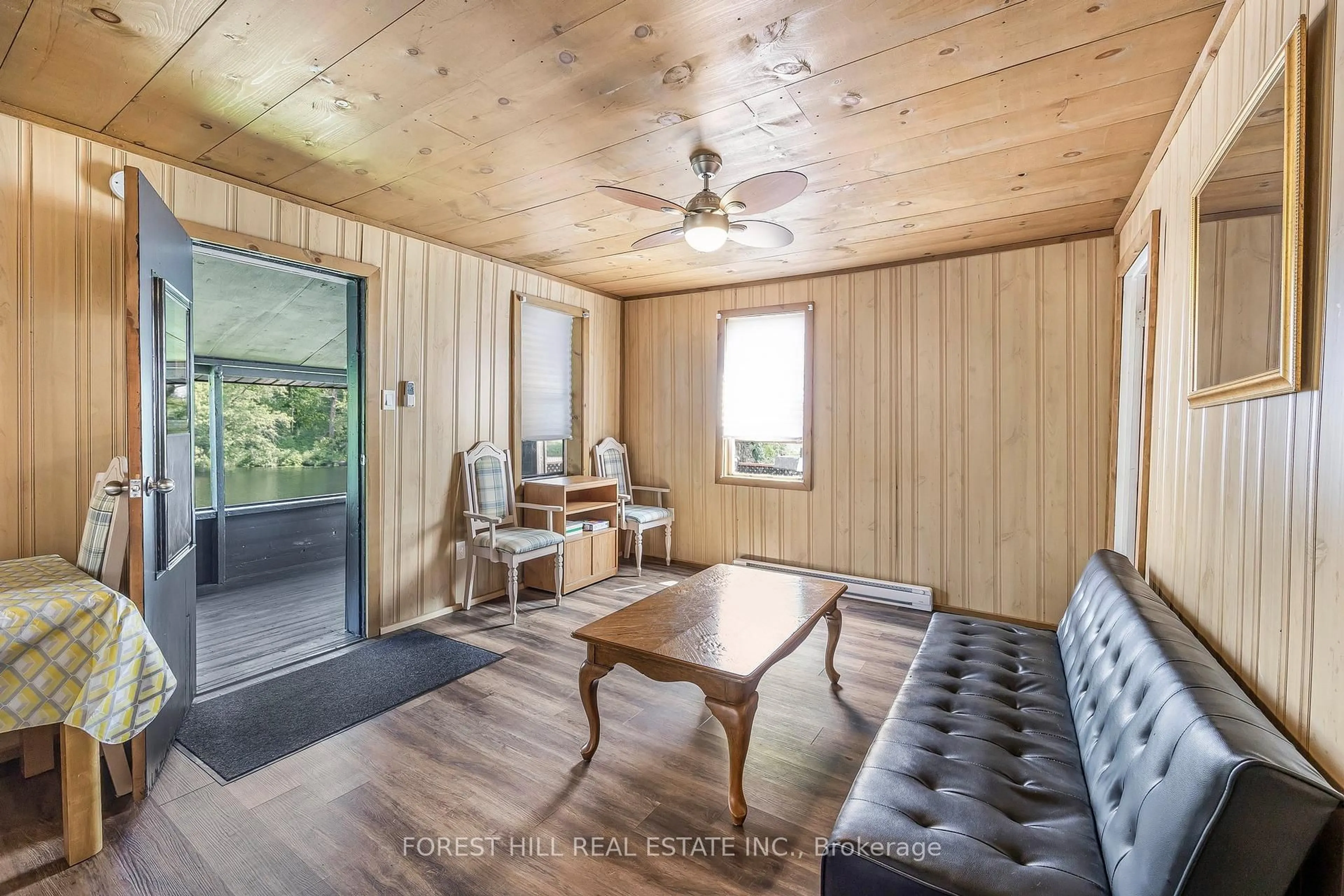 Living room with furniture, wood/laminate floor for 2216 Hwy 124, Whitestone Ontario P0A 1G0