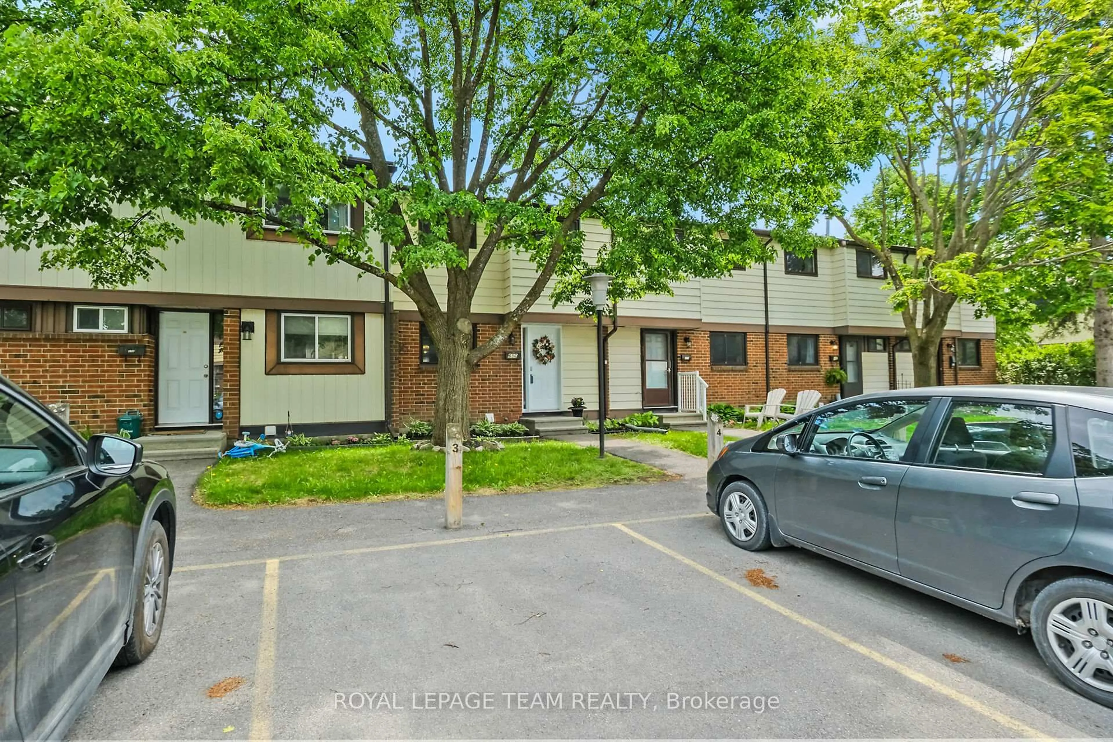 A pic from outside/outdoor area/front of a property/back of a property/a pic from drone, street for 65 Foxfield Dr #C, Ottawa Ontario K2J 1L7