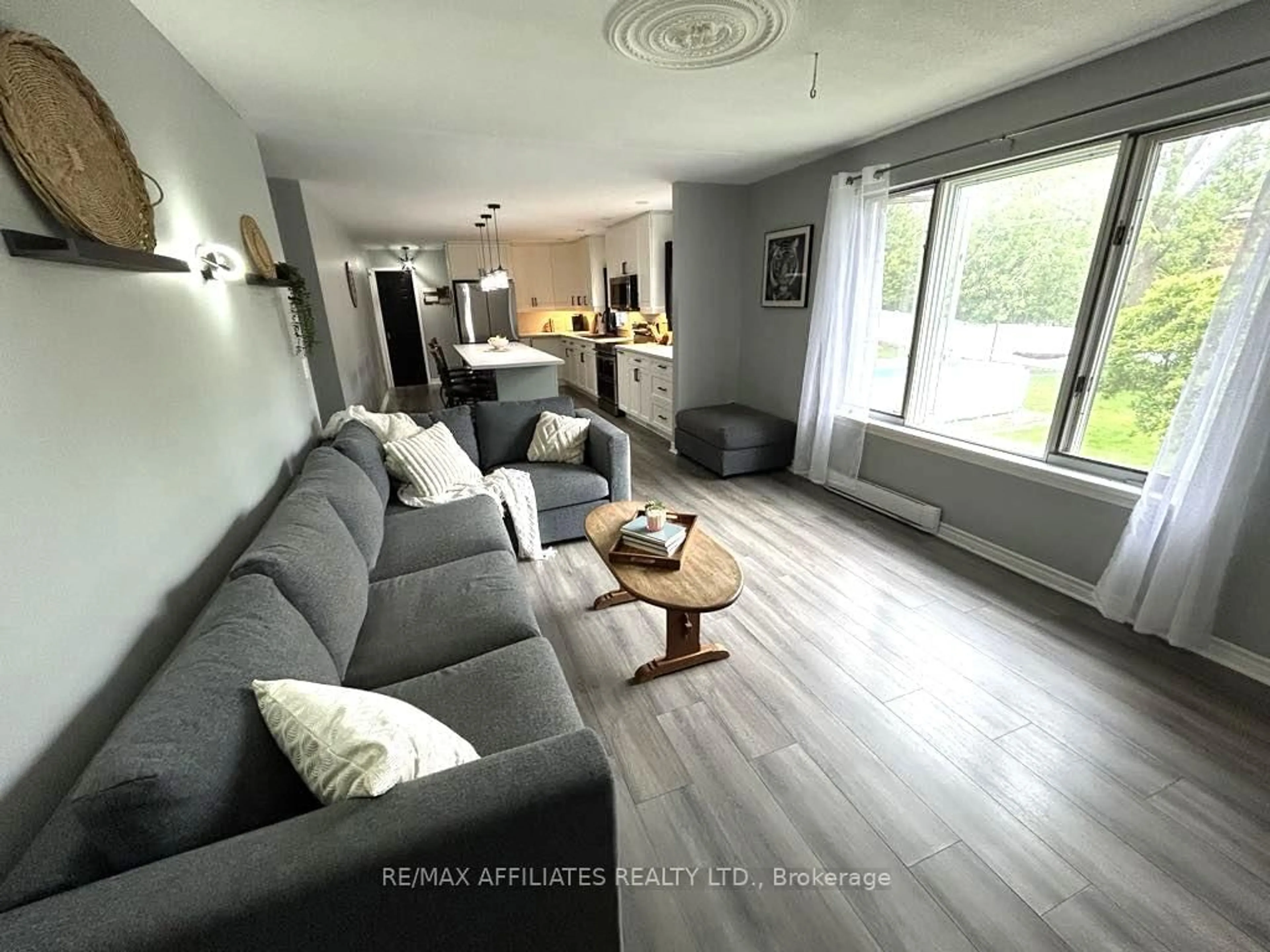 Living room with furniture, wood/laminate floor for 47 Gladstone Ave, Smiths Falls Ontario K7A 1R8