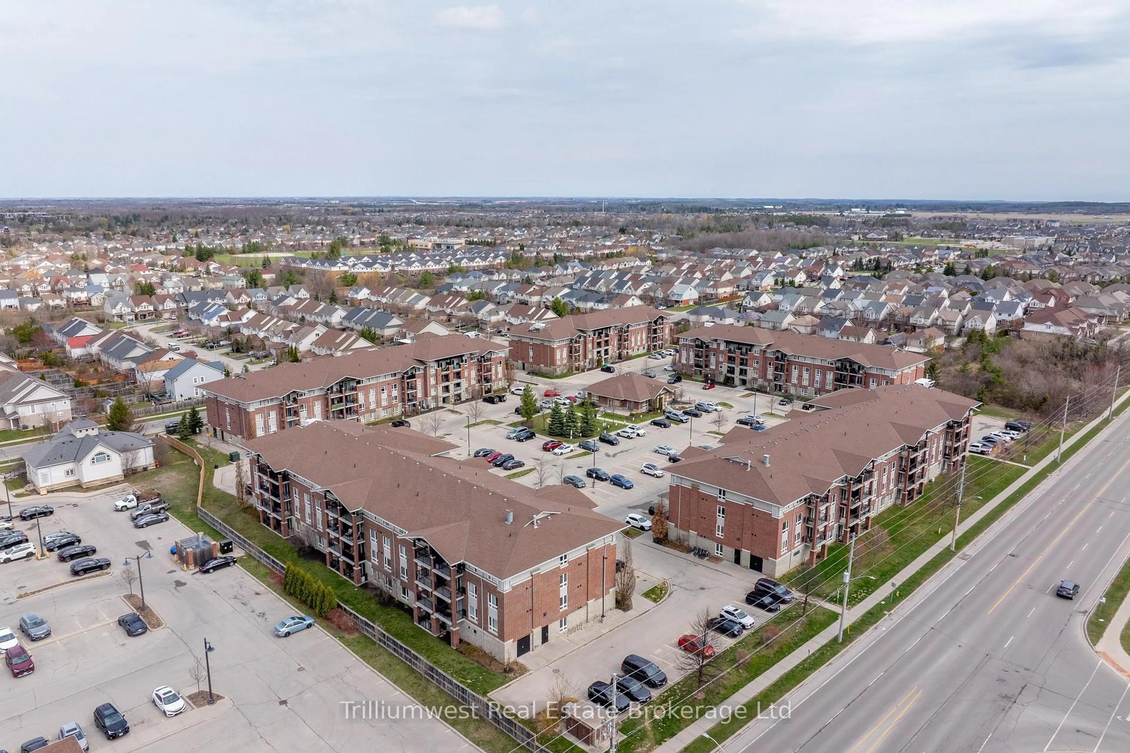 A pic from outside/outdoor area/front of a property/back of a property/a pic from drone, unknown for 39 Goodwin Dr #205, Guelph Ontario N1L 0E5