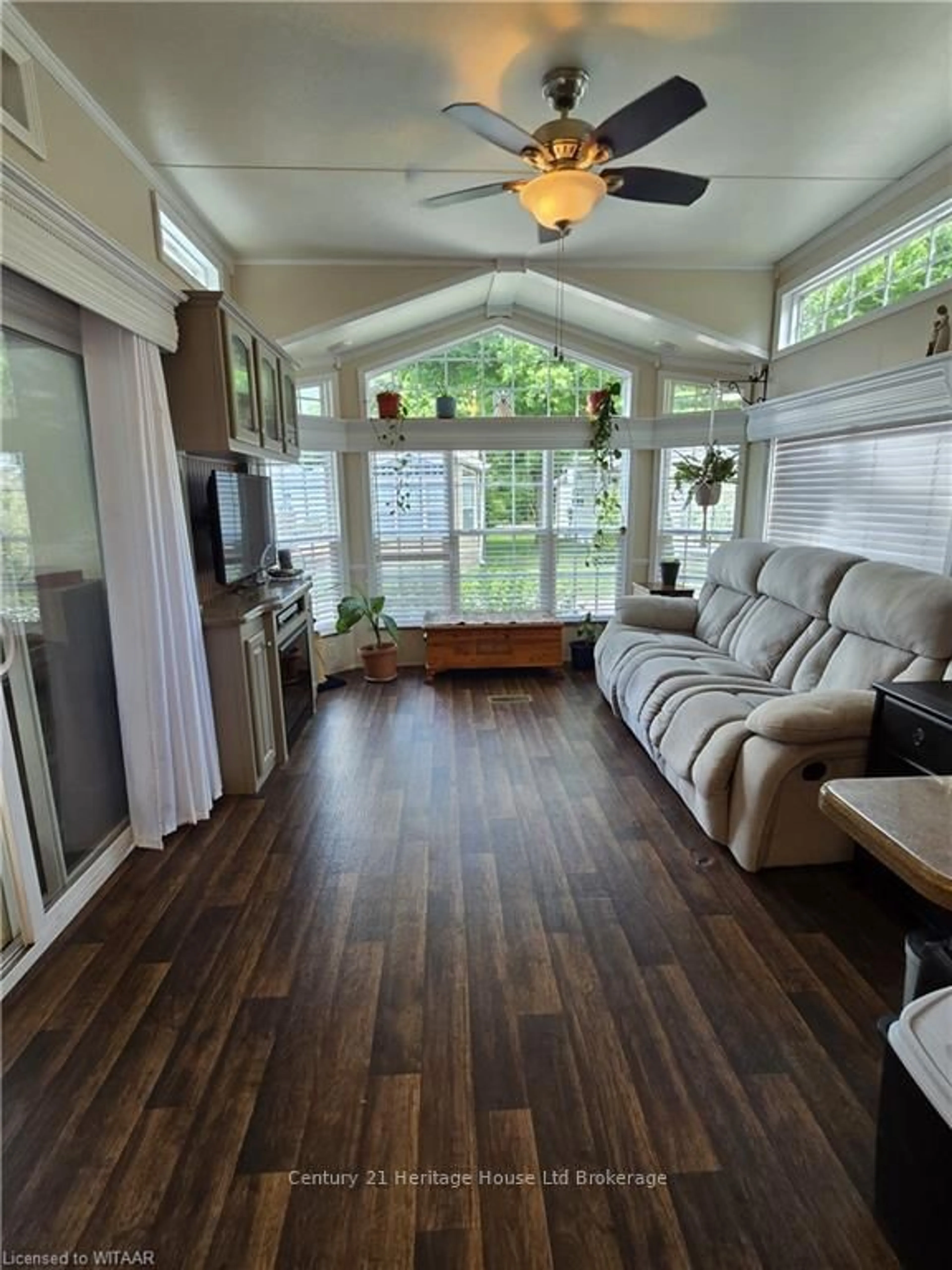 Living room with furniture, wood/laminate floor for 296 West Quarter Town Li Rd #54, Brant Ontario N0E 1E0
