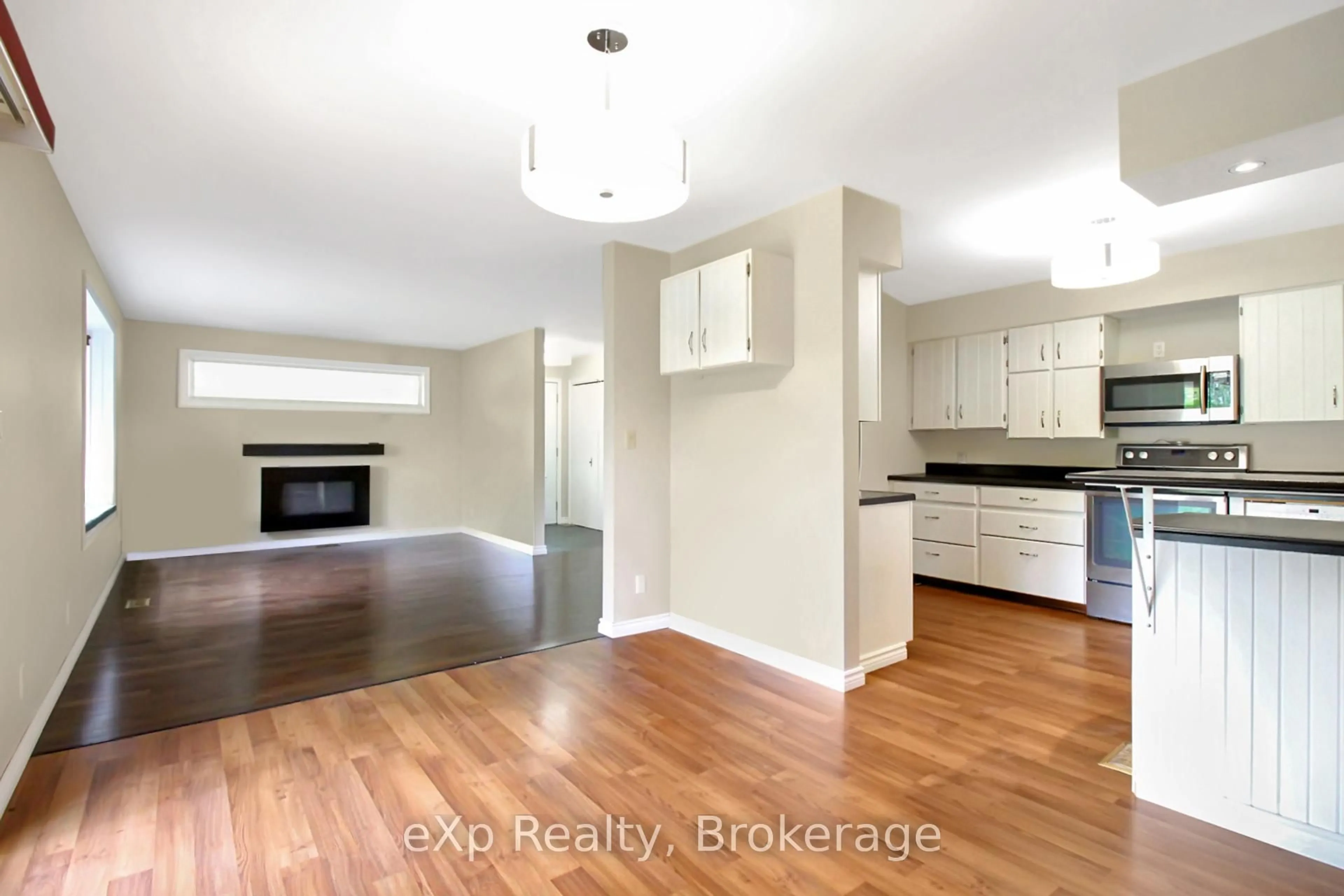 Open concept kitchen, wood/laminate floor for 99 Eliza St, Grey Highlands Ontario N0C 1H0