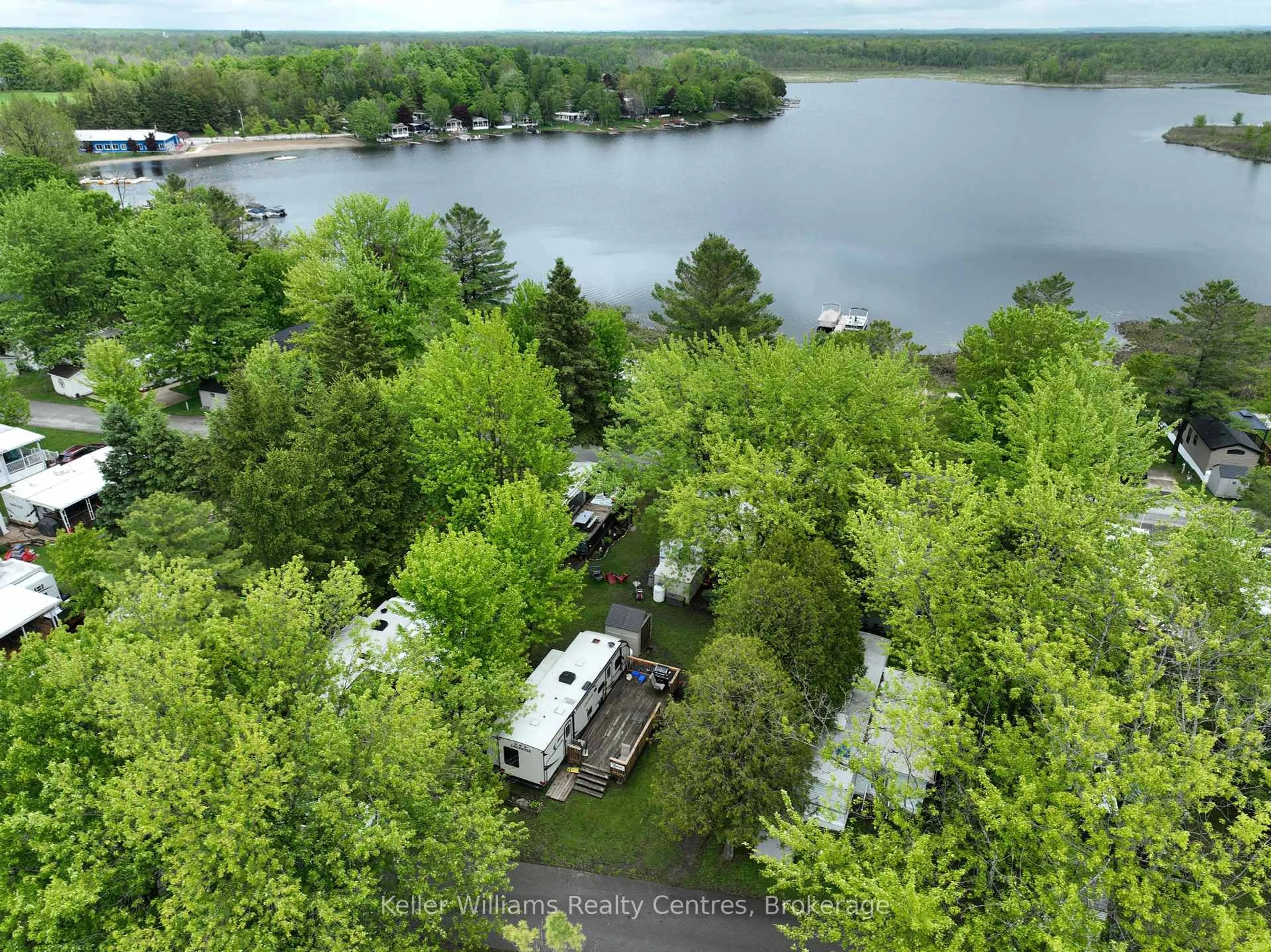 A pic from outside/outdoor area/front of a property/back of a property/a pic from drone, water/lake/river/ocean view for 13 Southline Ave #A84, Huron-Kinloss Ontario N2Z 2X5