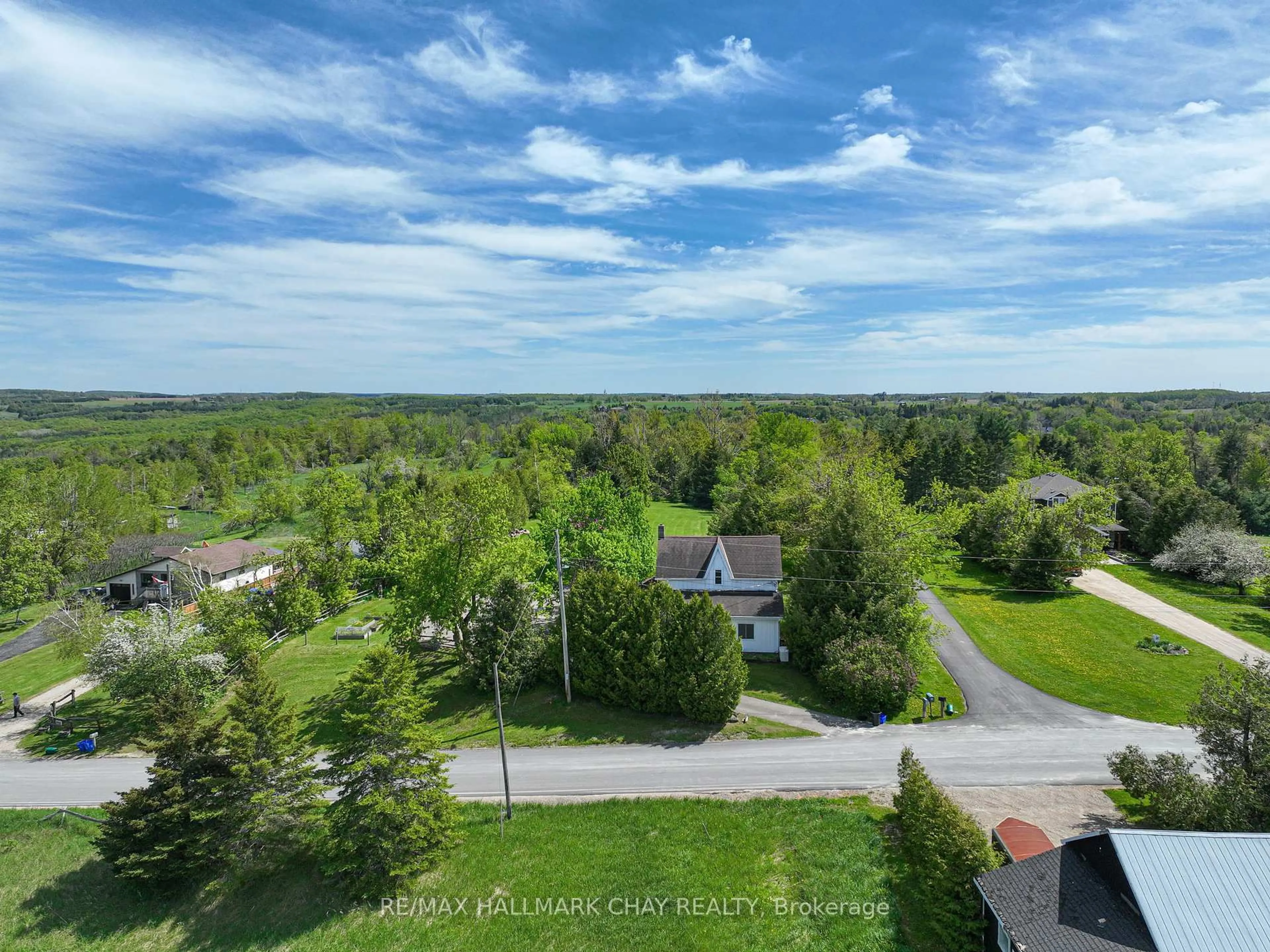 A pic from outside/outdoor area/front of a property/back of a property/a pic from drone, water/lake/river/ocean view for 22 Mill Lane, Melancthon Ontario L9V 2T9