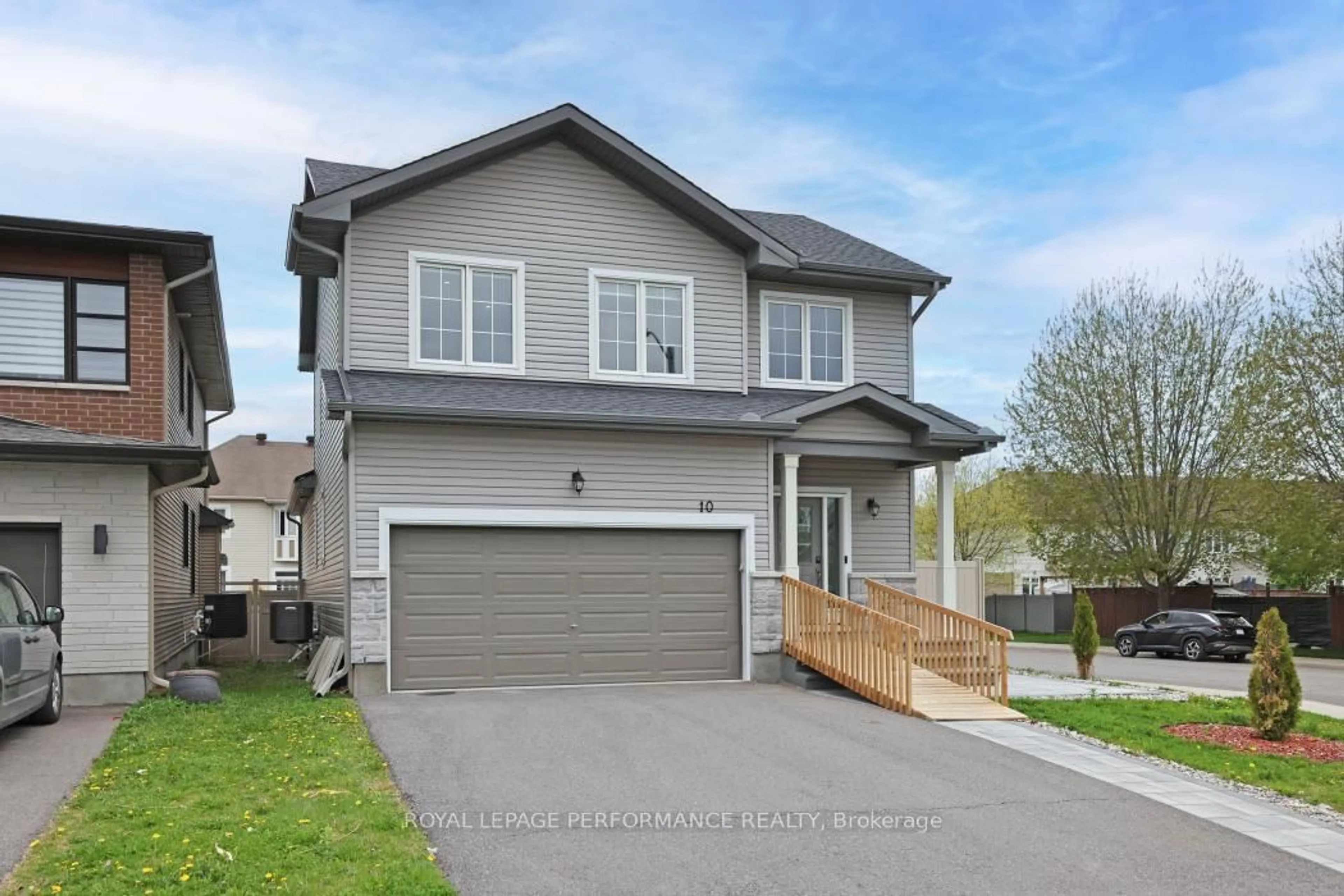 Home with vinyl exterior material, street for 10 Kinetic Way, Ottawa Ontario K2J 0C9