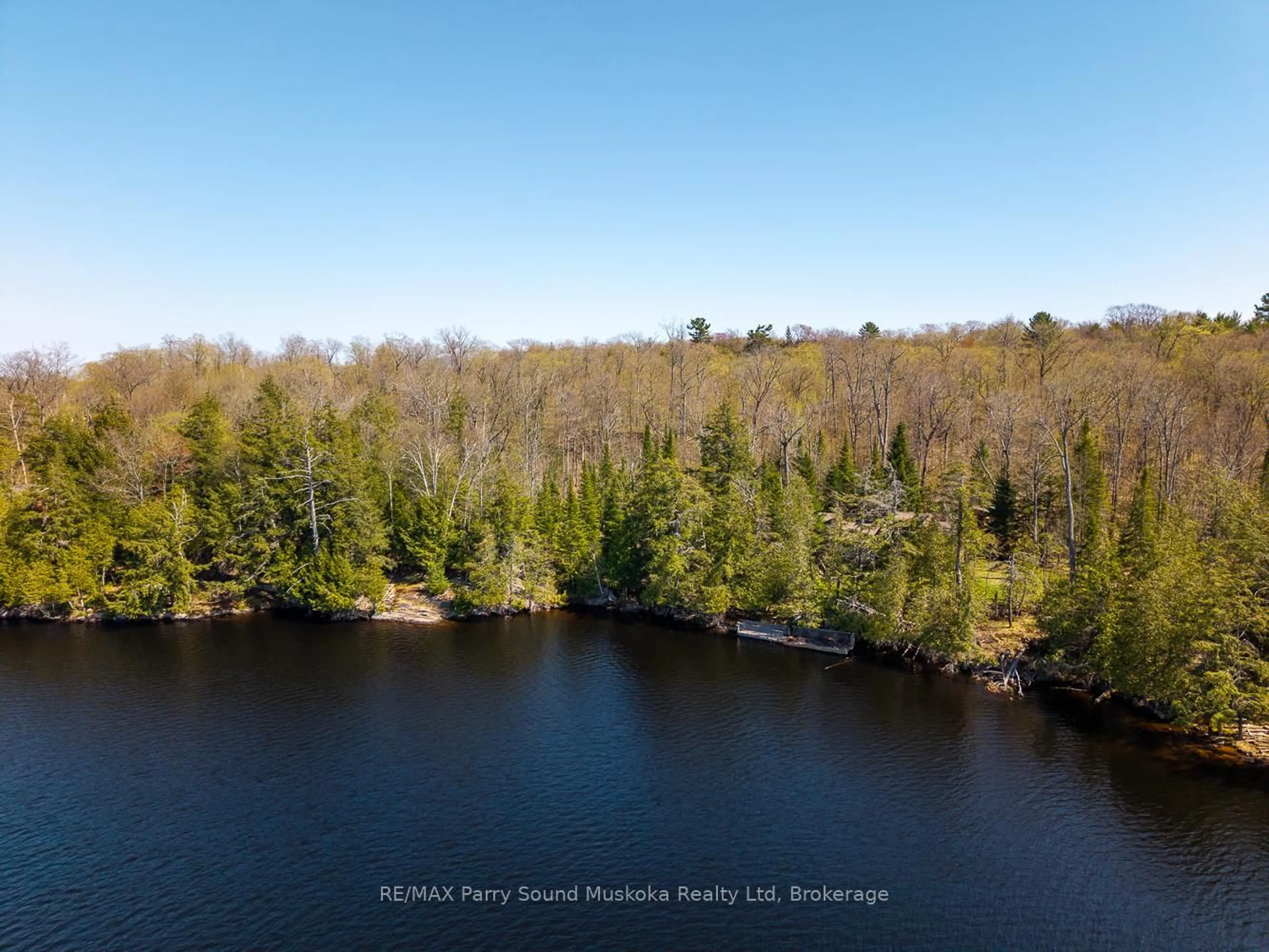A pic from outside/outdoor area/front of a property/back of a property/a pic from drone, water/lake/river/ocean view for 23 Dancy Lane, McKellar Ontario P2A 0B5