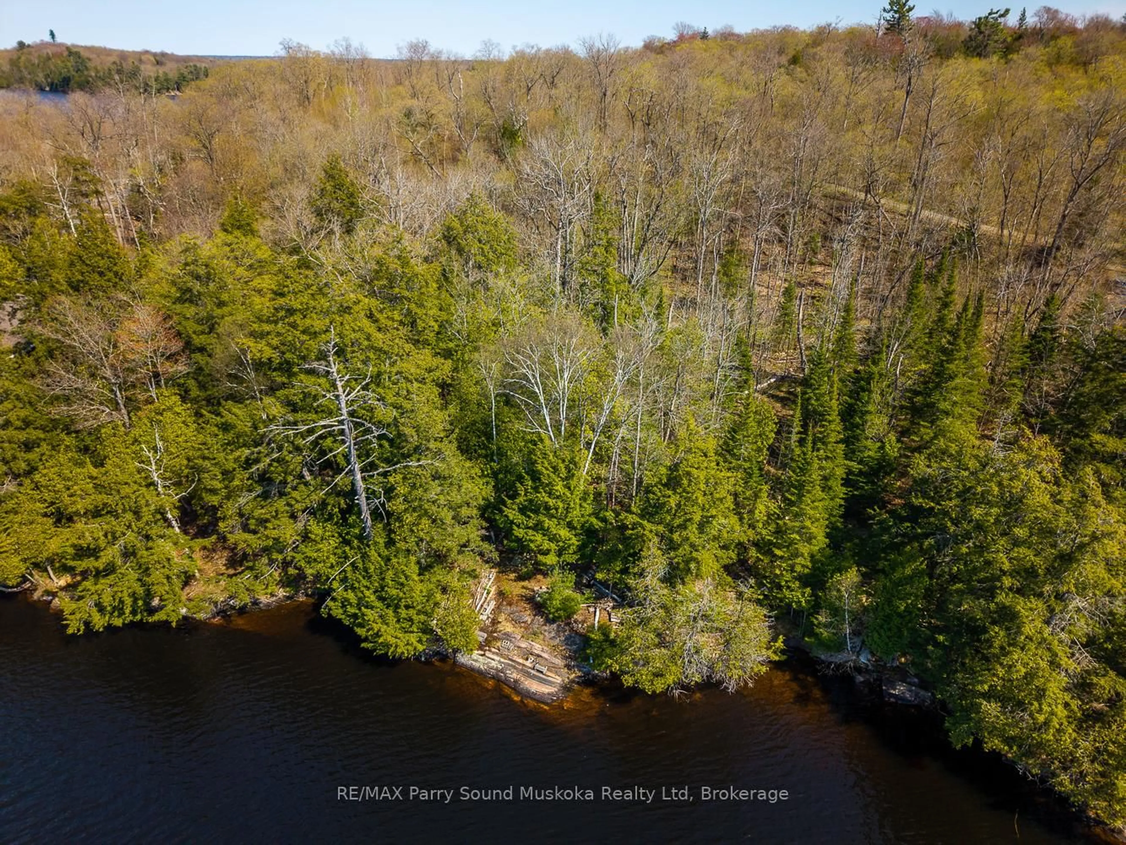 A pic from outside/outdoor area/front of a property/back of a property/a pic from drone, water/lake/river/ocean view for 23 Dancy Lane, McKellar Ontario P2A 0B5