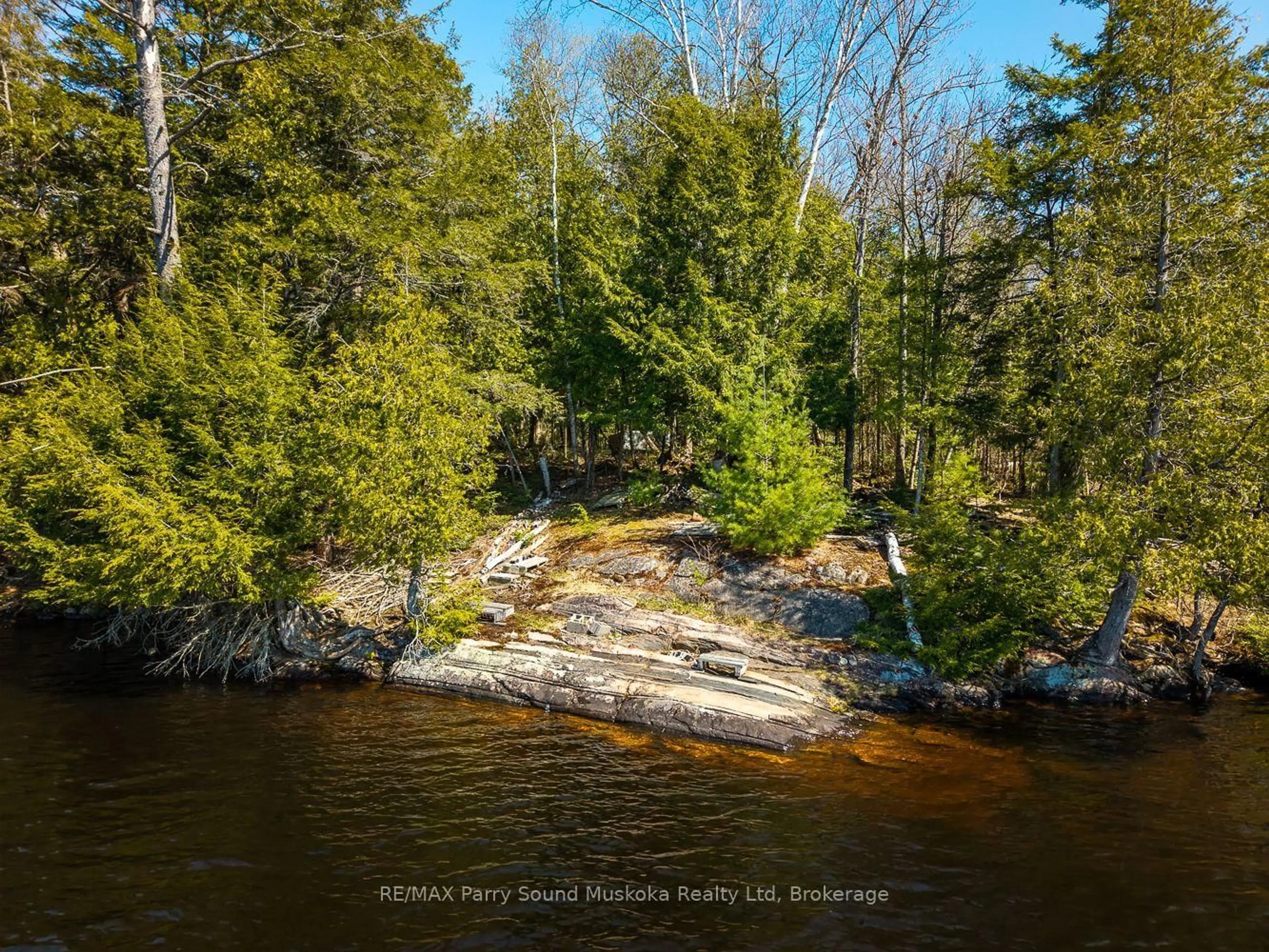 A pic from outside/outdoor area/front of a property/back of a property/a pic from drone, water/lake/river/ocean view for 23 Dancy Lane, McKellar Ontario P2A 0B5