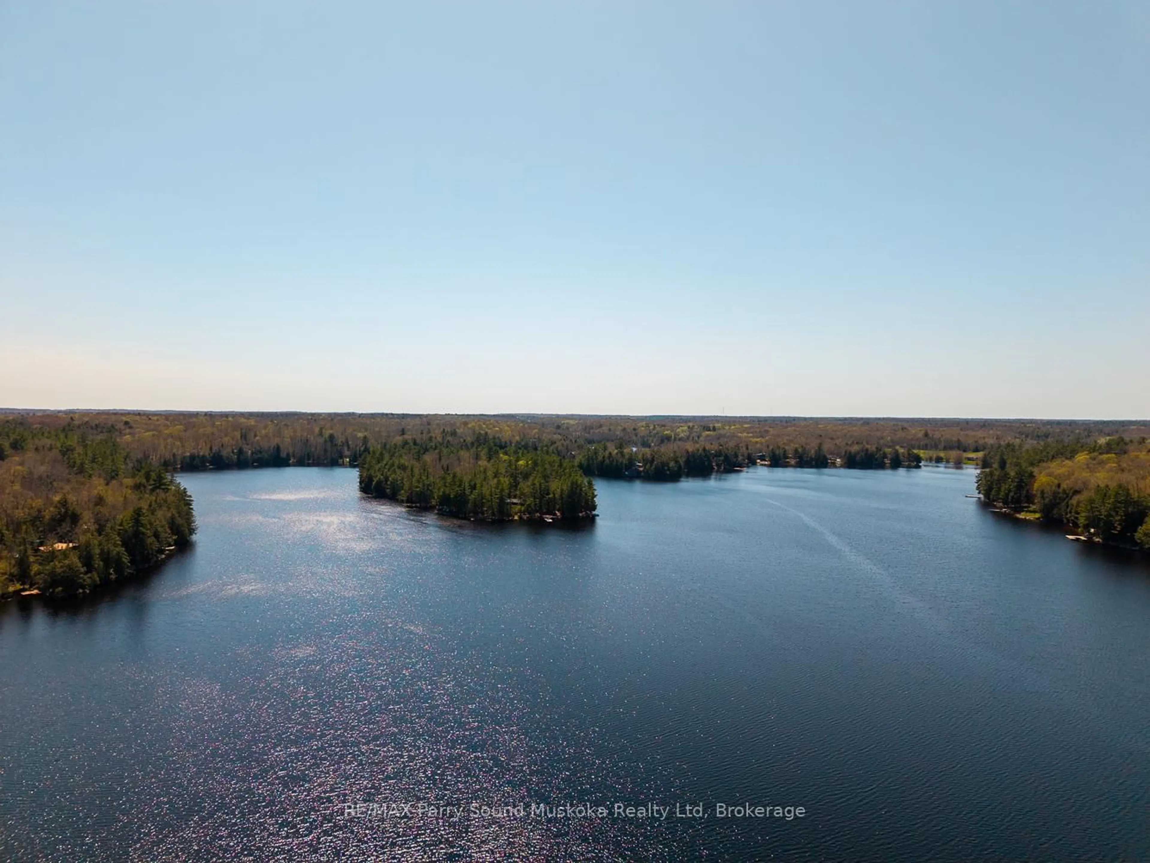 A pic from outside/outdoor area/front of a property/back of a property/a pic from drone, water/lake/river/ocean view for 25 Dancy Lane, McKellar Ontario P2A 0B5
