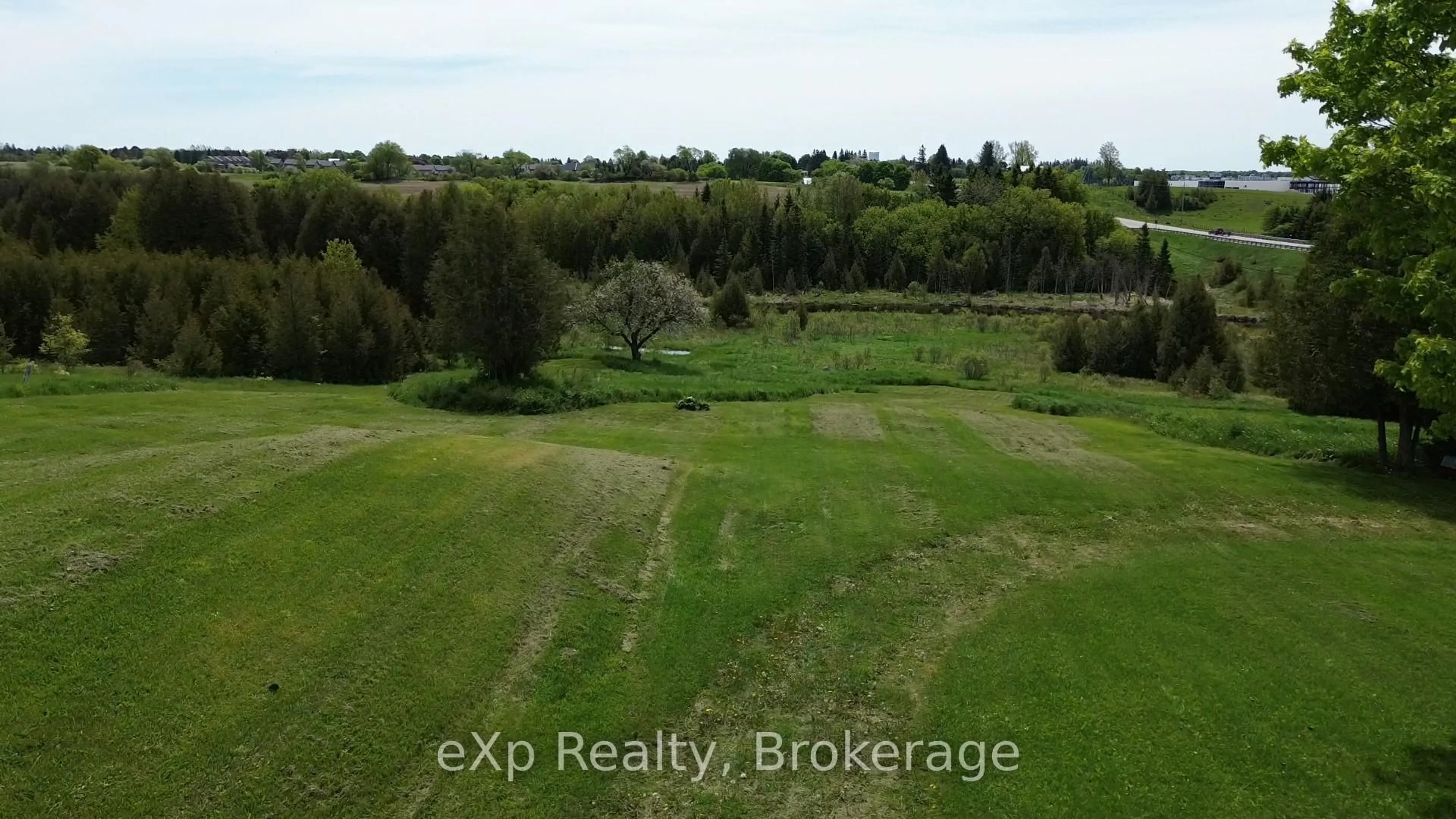 A pic from outside/outdoor area/front of a property/back of a property/a pic from drone, water/lake/river/ocean view for 775355 10 Highway, Grey Highlands Ontario N0C 1H0