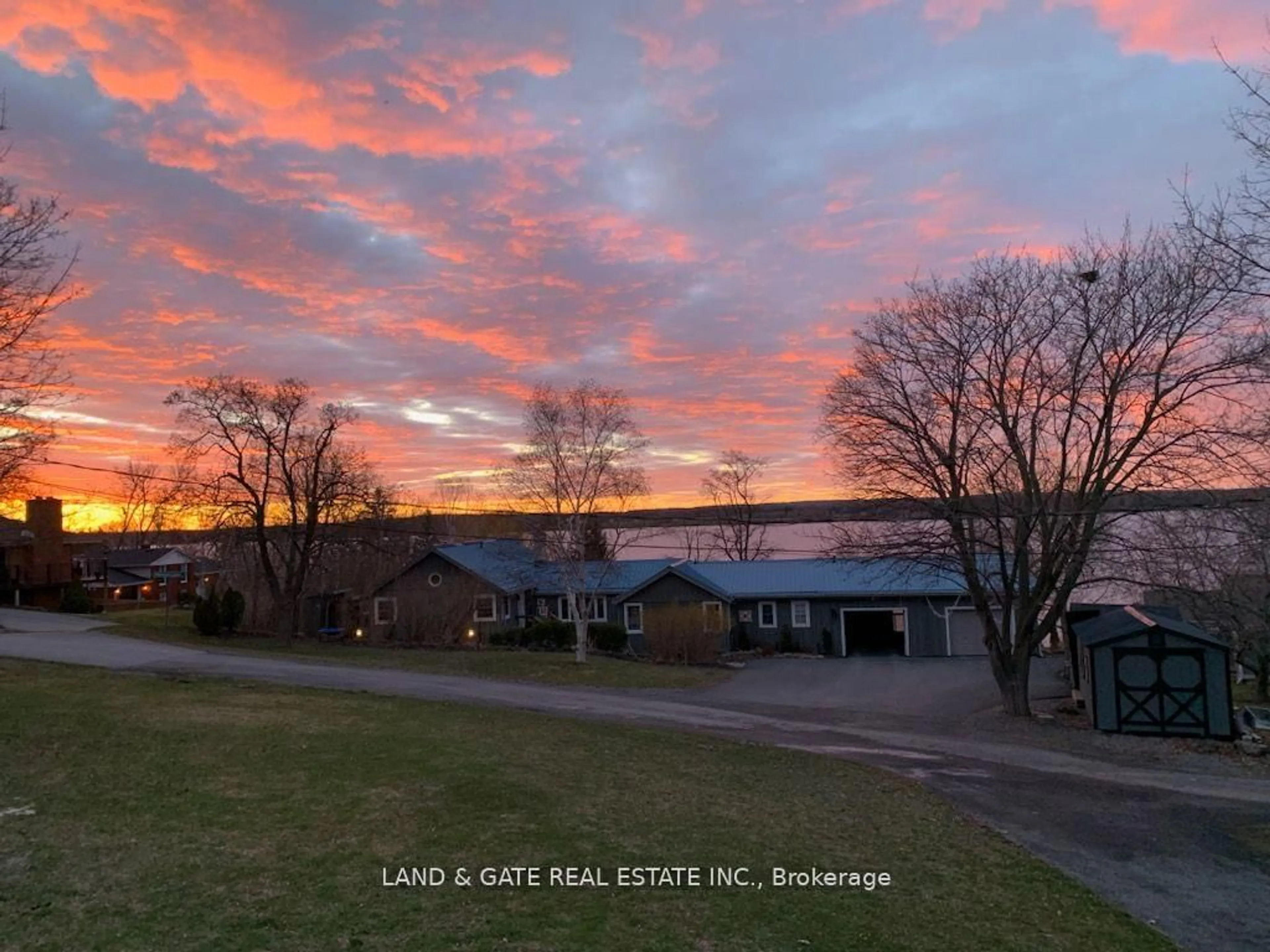 A pic from outside/outdoor area/front of a property/back of a property/a pic from drone, water/lake/river/ocean view for 14 Eastern Ave, Prince Edward County Ontario K8N 4Z1