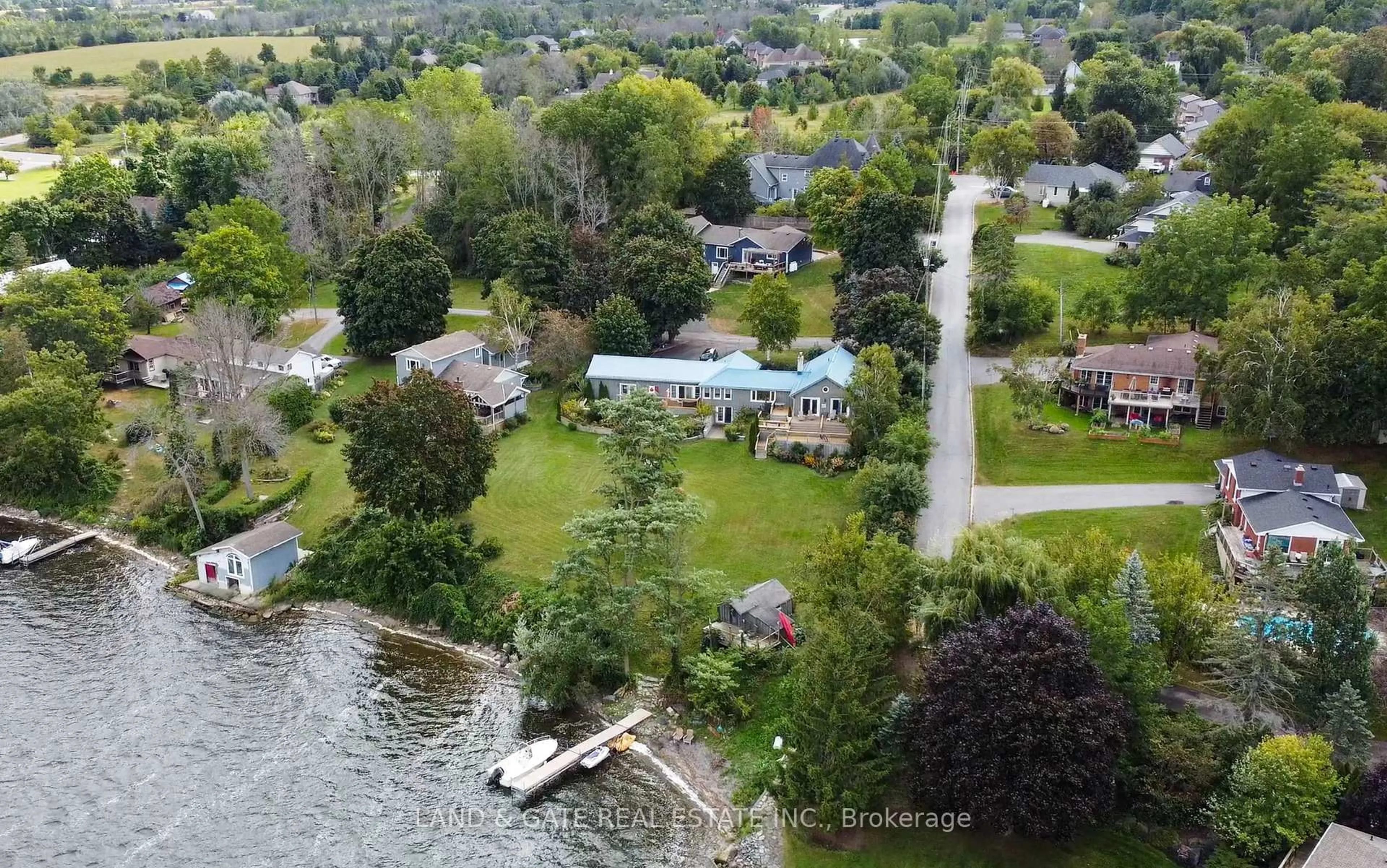 A pic from outside/outdoor area/front of a property/back of a property/a pic from drone, water/lake/river/ocean view for 14 Eastern Ave, Prince Edward County Ontario K8N 4Z1