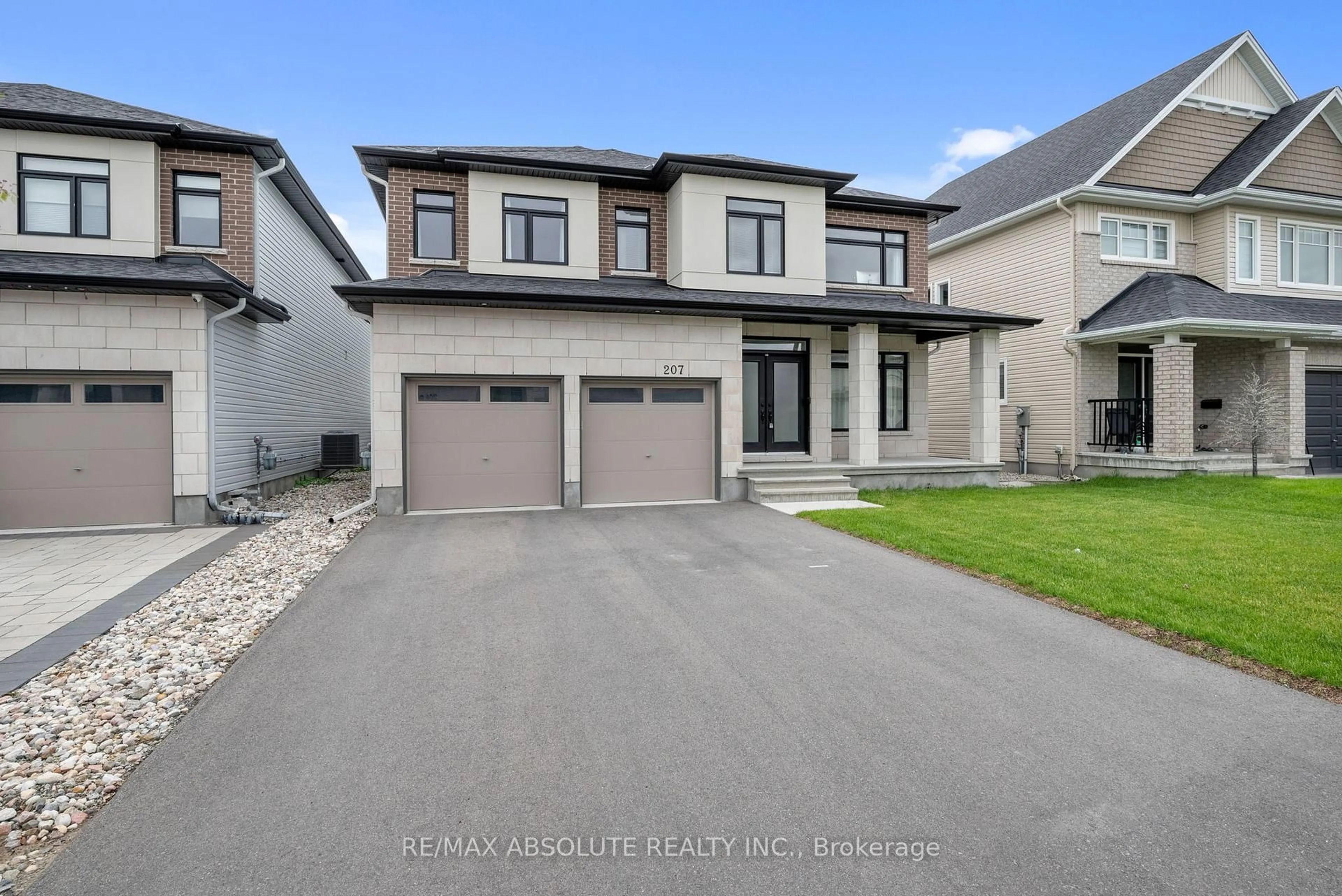 Home with vinyl exterior material, street for 207 Osterley Way, Ottawa Ontario K2S 2N6